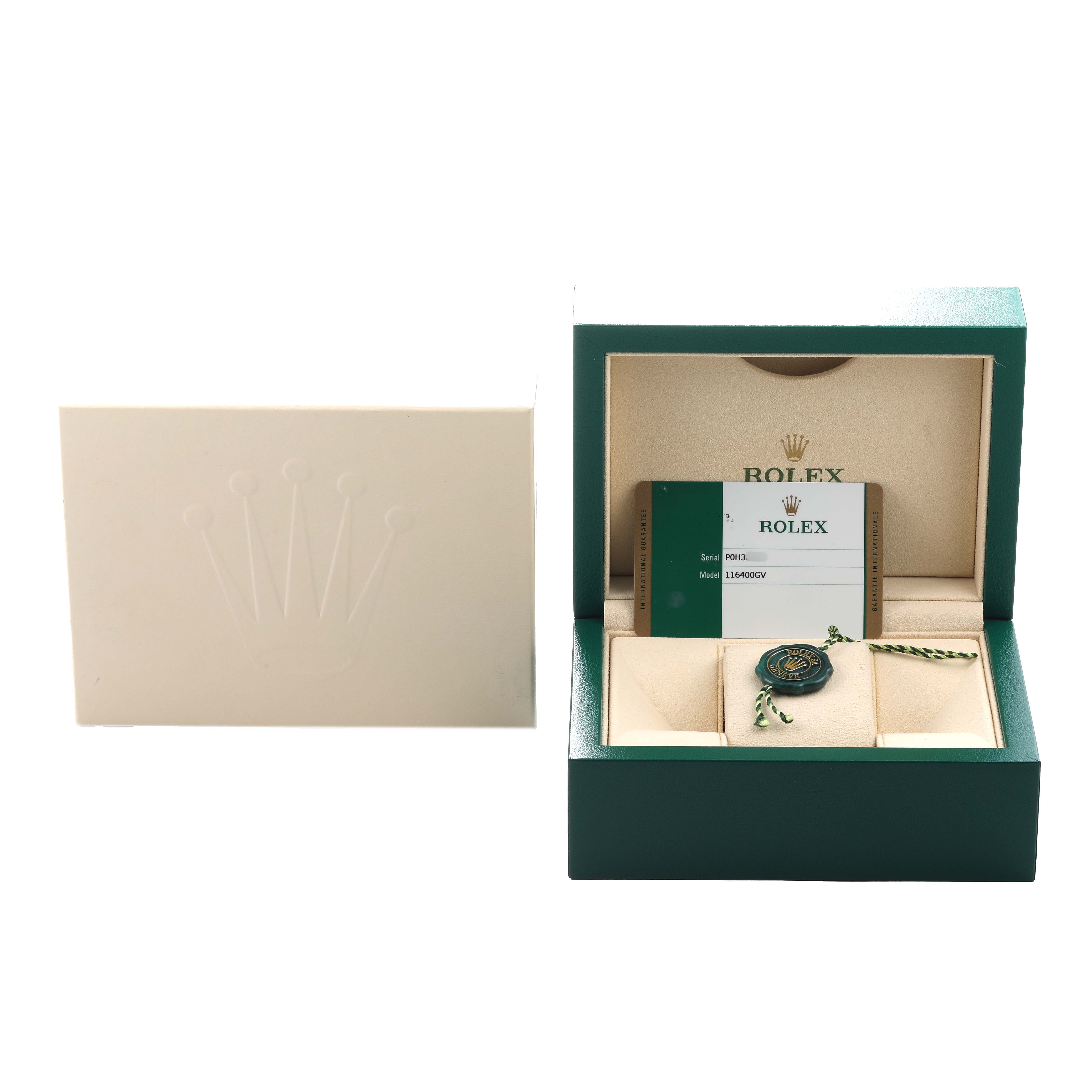 The image shows a Rolex Milgauss 116400GV Men's Stainless Steel Blue Dial box and accessories, including the card and tag, with an angled view of the open box.