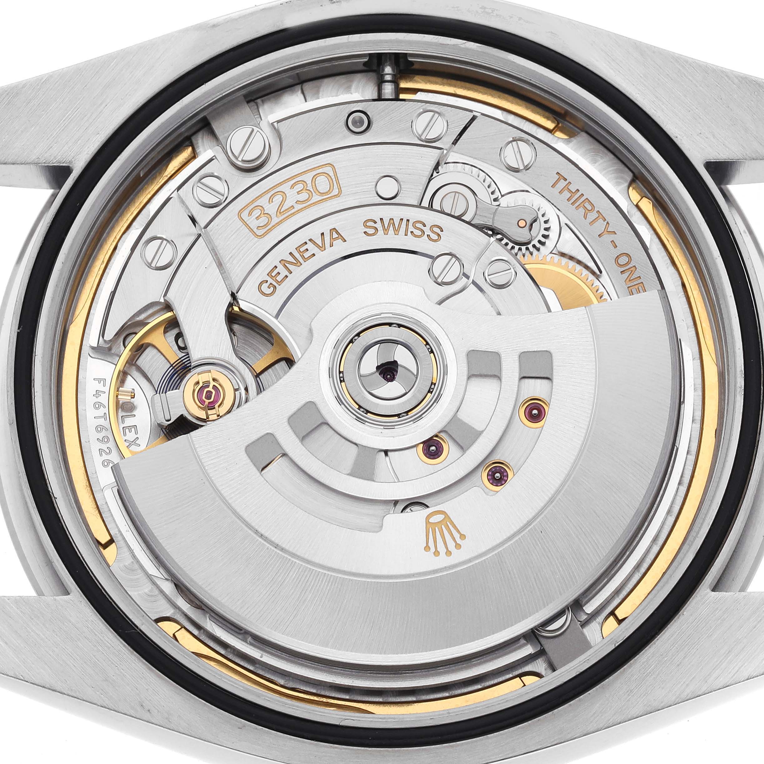 The image shows the internal movement of a Rolex Oyster Perpetual 124300 Men's Stainless Steel Blue Dial 124300 Men's Stainless Steel Blue Dial watch viewed from the back, highlighting gears and components.