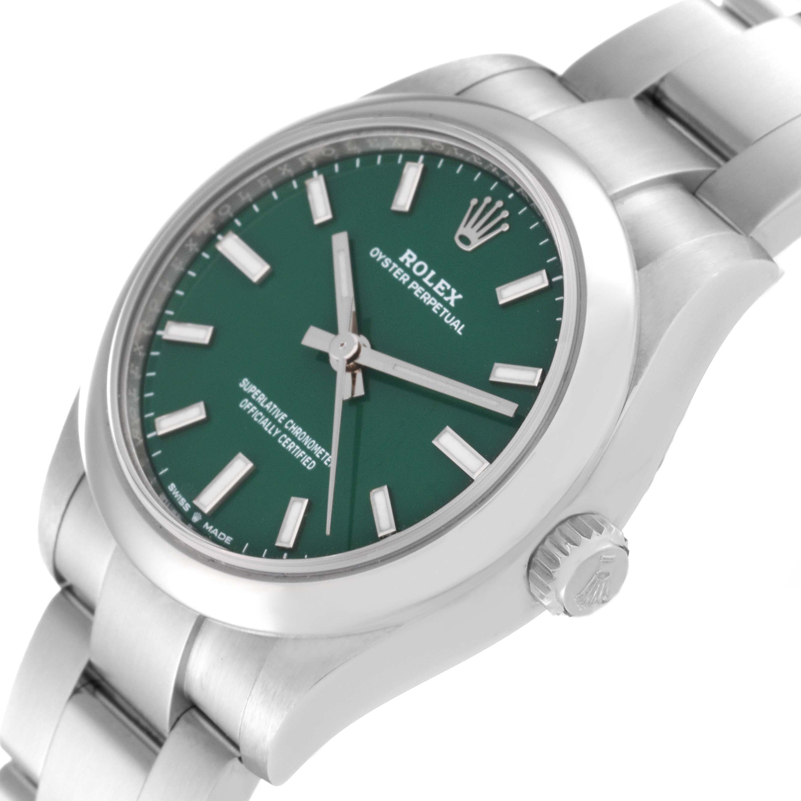The Rolex Mid-Size 277200 Women's Stainless Steel Green Dial 277200 Women's Stainless Steel Green Dial Oyster Perpetual watch is shown at an angle highlighting its green dial, crown, and part of the bracelet.