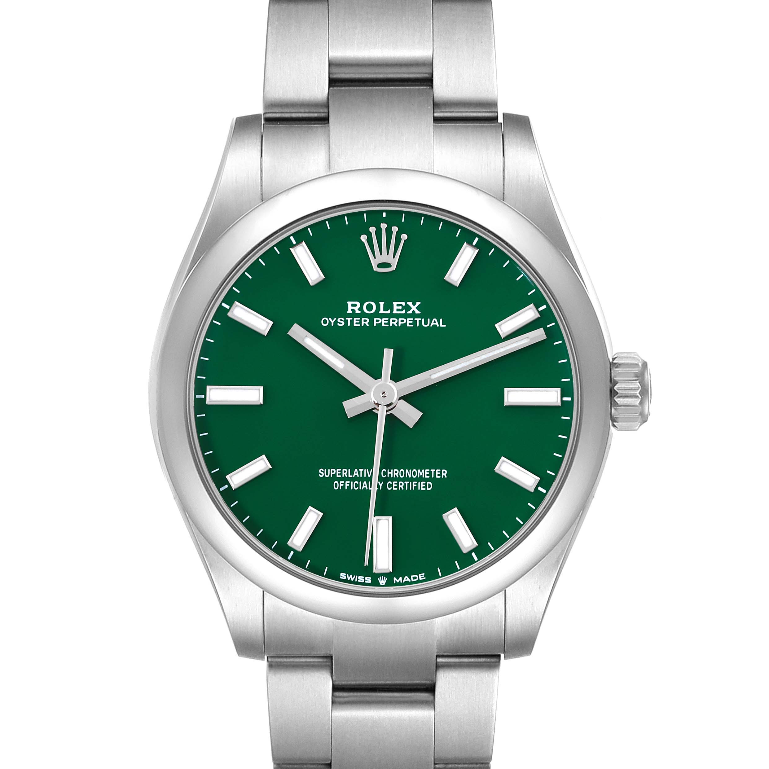 The Rolex Oyster Perpetual Mid-Size watch is shown from a front angle, displaying its green dial and stainless steel bracelet.