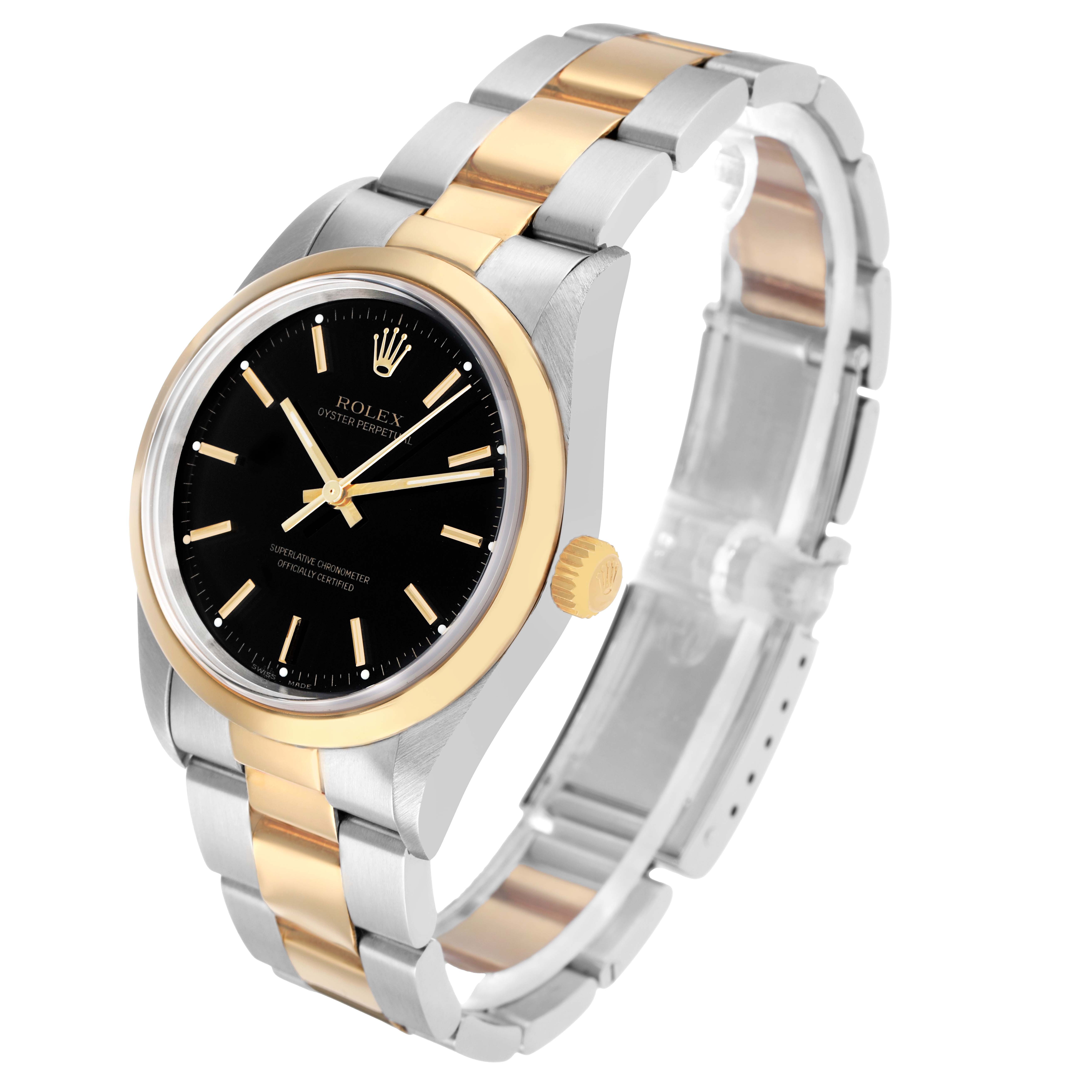 The Rolex Oyster Perpetual 14203 Men's Steel and Gold (two tone) Black Dial watch is shown at an angle displaying the face, bezel, crown, and a portion of the bracelet.