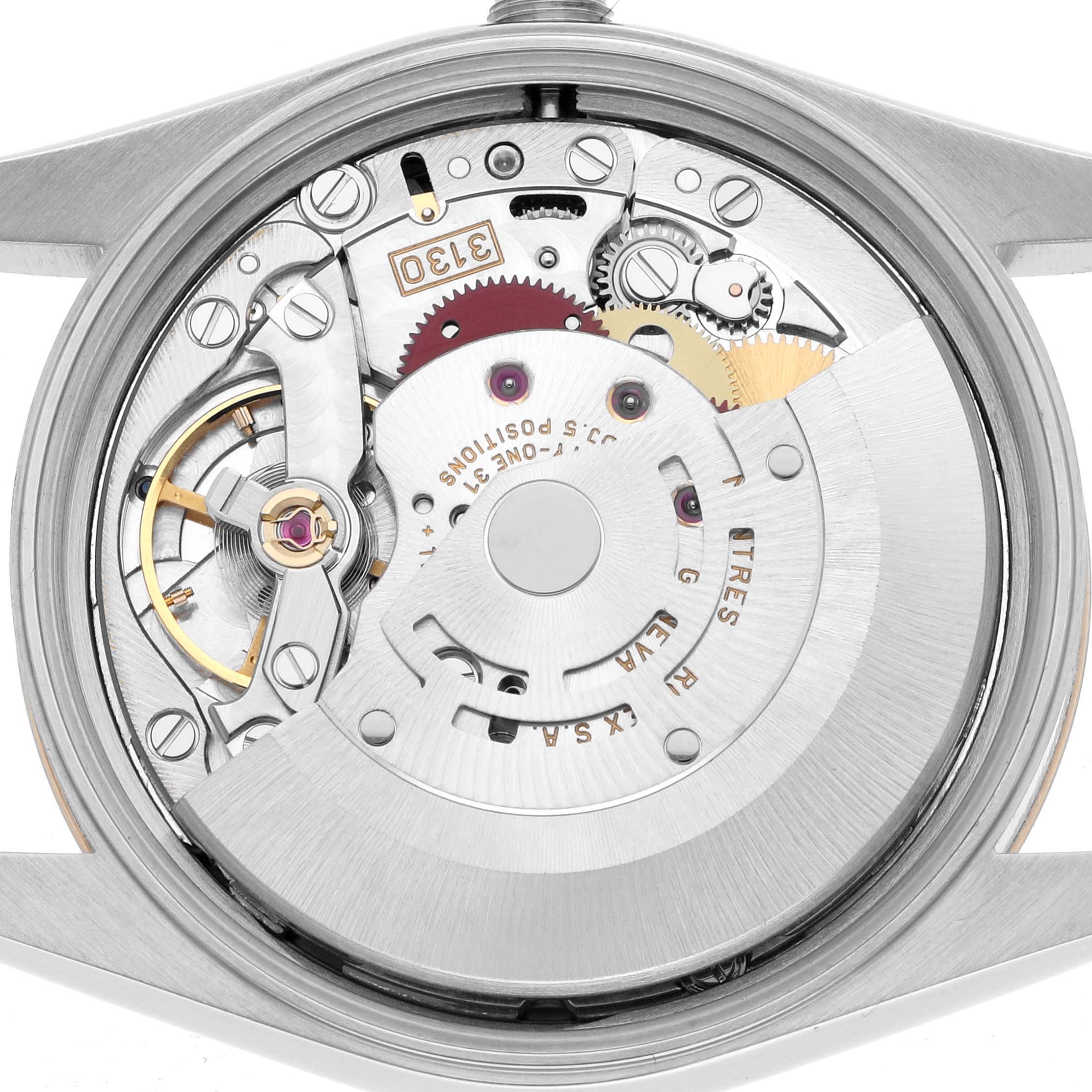 The image shows the Rolex Oyster Perpetual 14203 Men's Steel and Gold (two tone) Black Dial watch movement from a top-down angle, highlighting its internal mechanics.