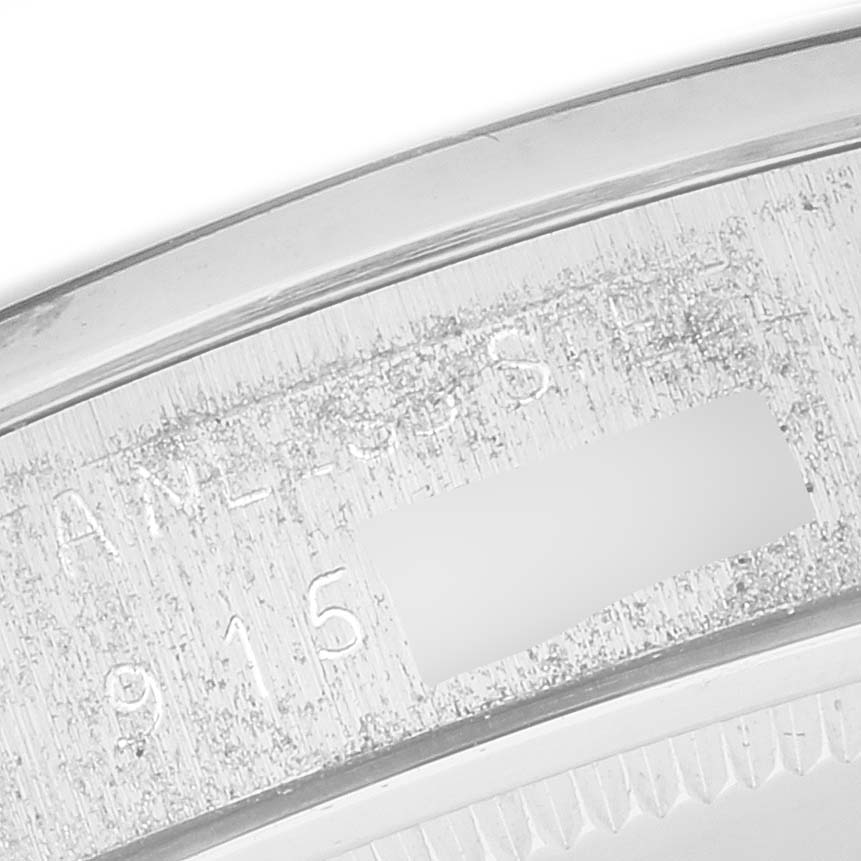 This close-up image shows the case's engraved serial number on a Rolex Vintage Collection 6694 Men's Stainless Steel Black Dial 6694 Men's Stainless Steel Black Dial model.