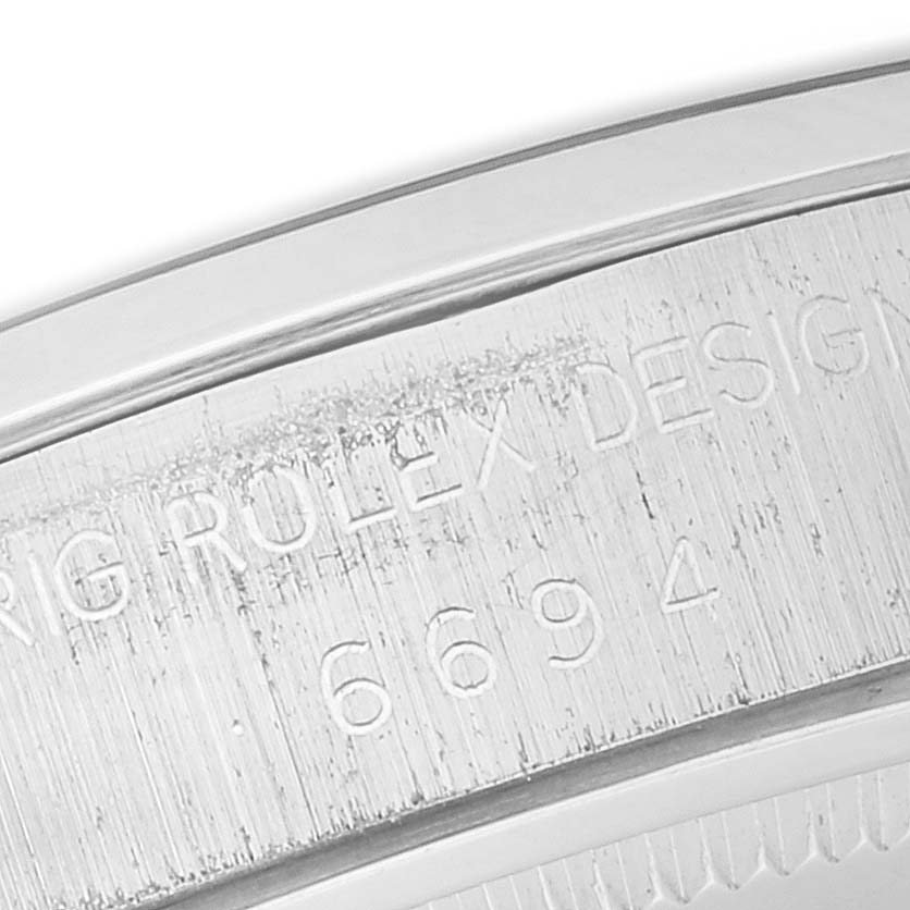The image shows a close-up of the side case with engraving details on the Vintage Collection model by Rolex.
