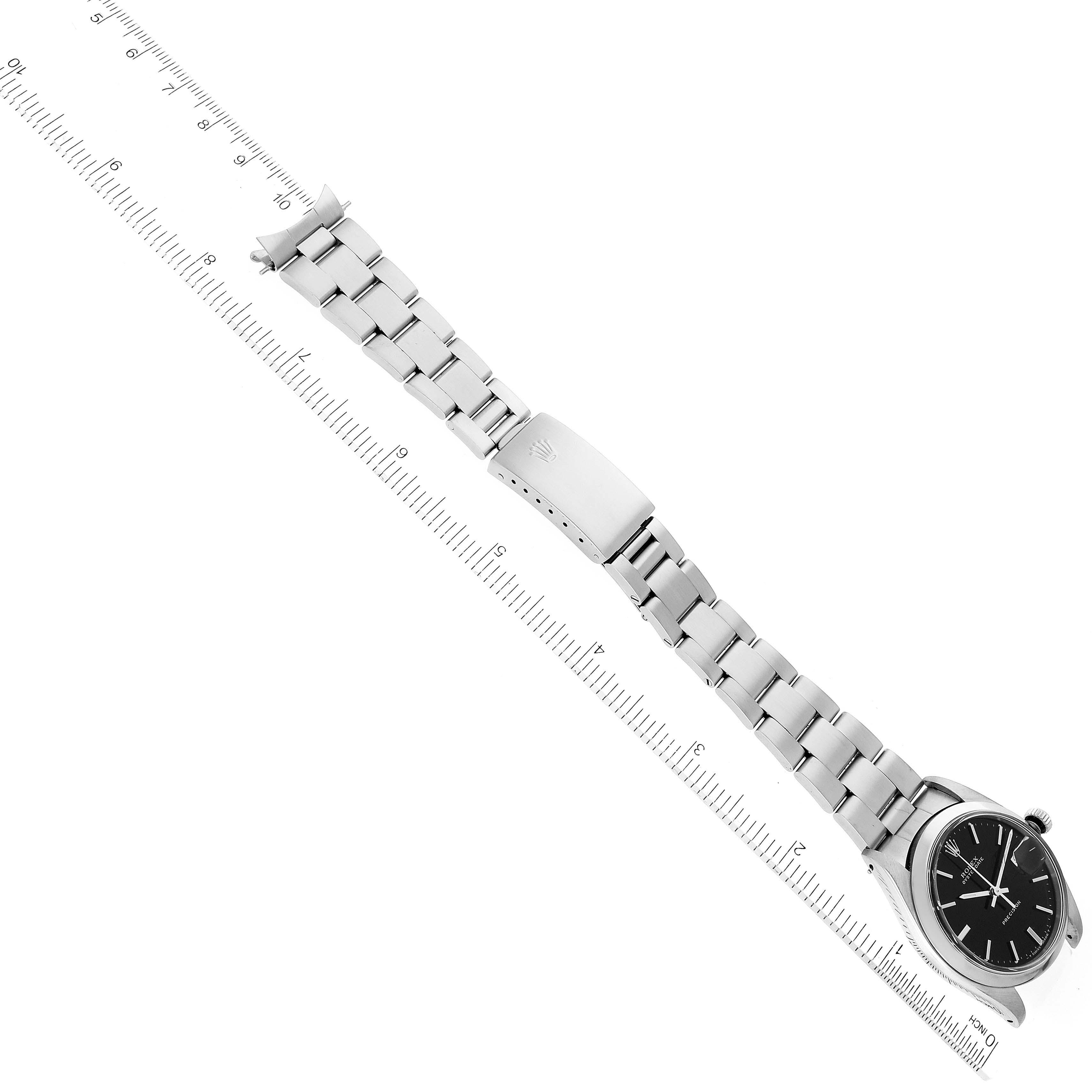 The image shows a top-down view of the Vintage Collection Rolex watch, displaying its face, band, and clasp next to a ruler.