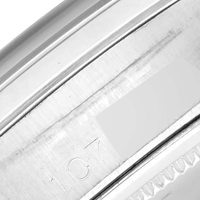 This close-up image shows the serial number engraving on the casing of a Vintage Collection Rolex watch.