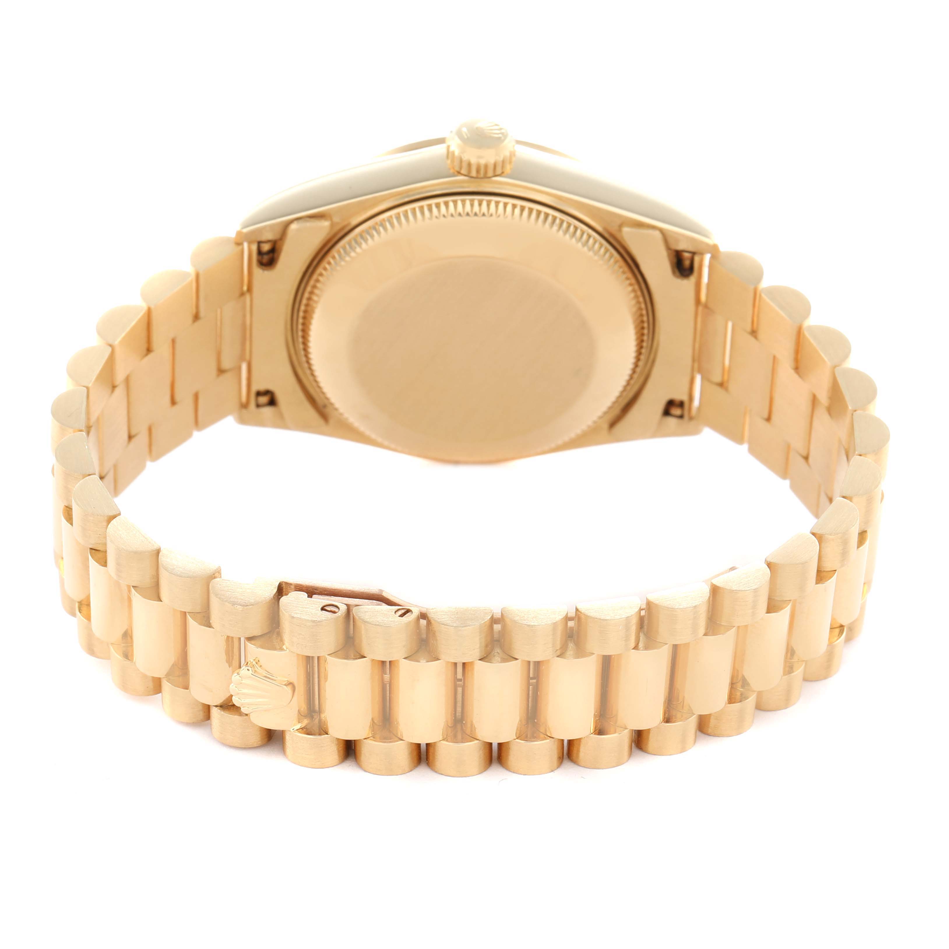 The image shows a Rolex President 68278 Women's Yellow Gold Silver Dial watch from the back, highlighting the case back and the bracelet.