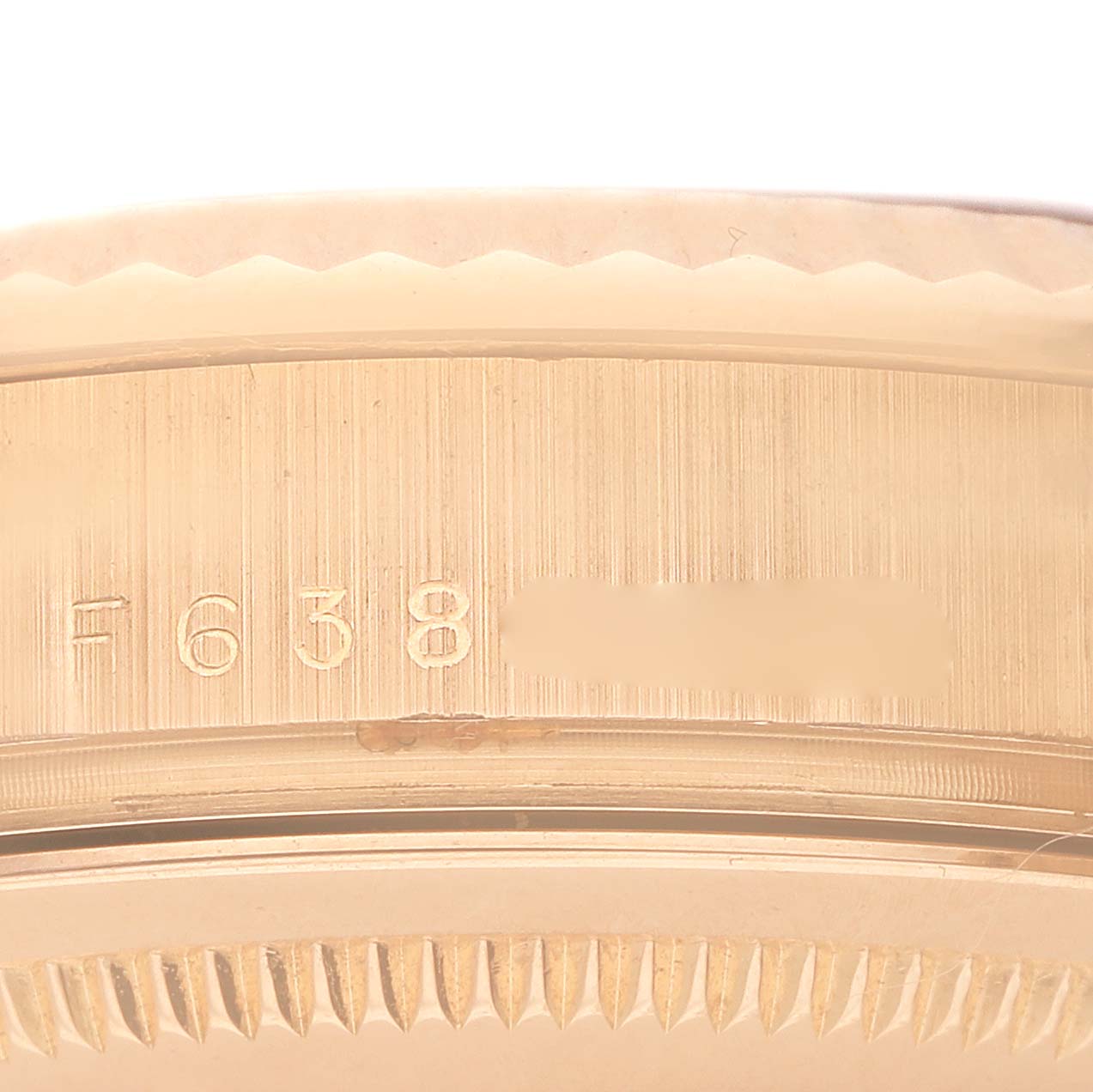 The image shows a close-up view of the serial number on the side of the Rolex President 118235 Men's Rose Gold Pink Dial watch case.