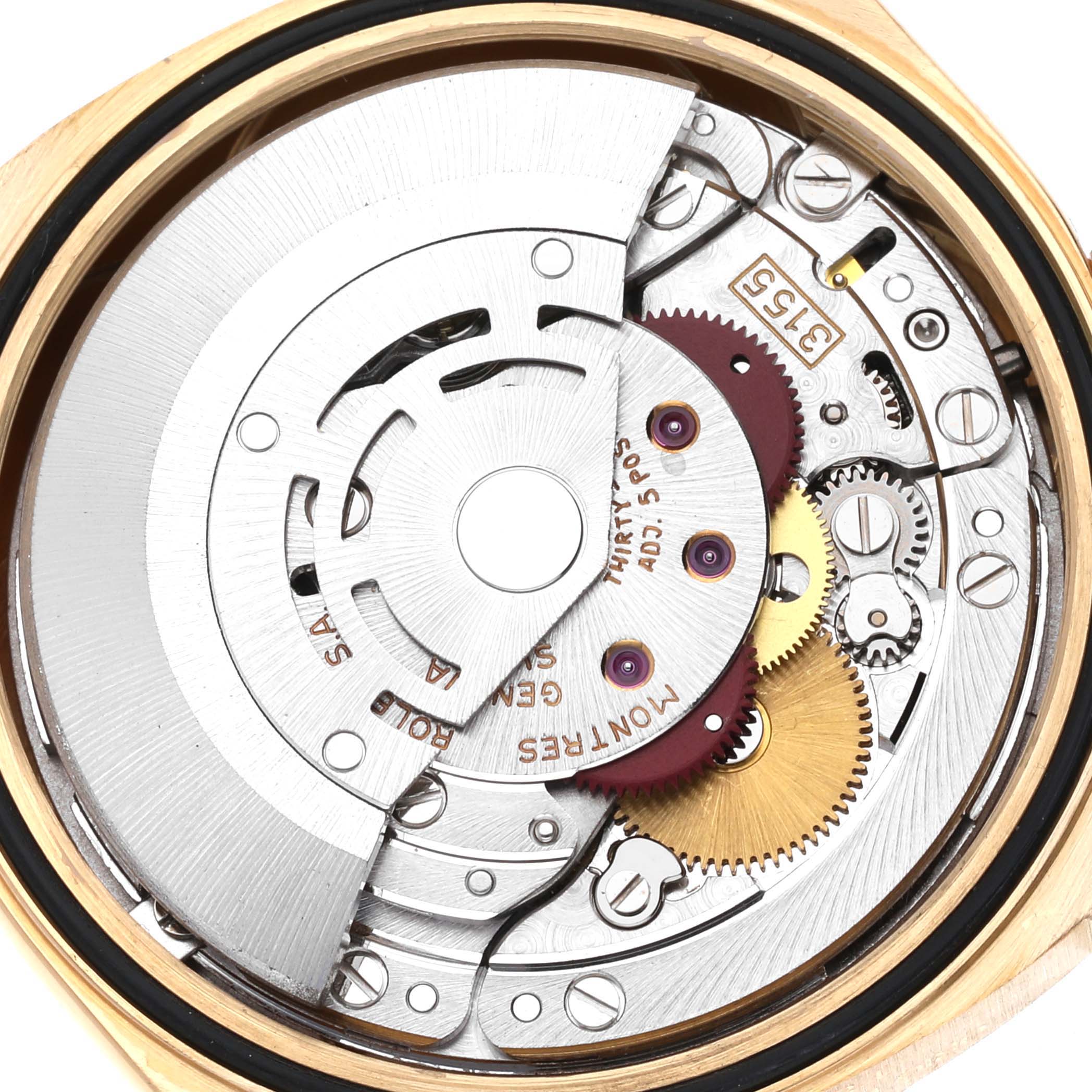 This is an inside view of the Rolex President 18238 Men's Yellow Gold Black Dial 18238 Men's Yellow Gold Black Dial model watch showing its intricate mechanical movement and components.