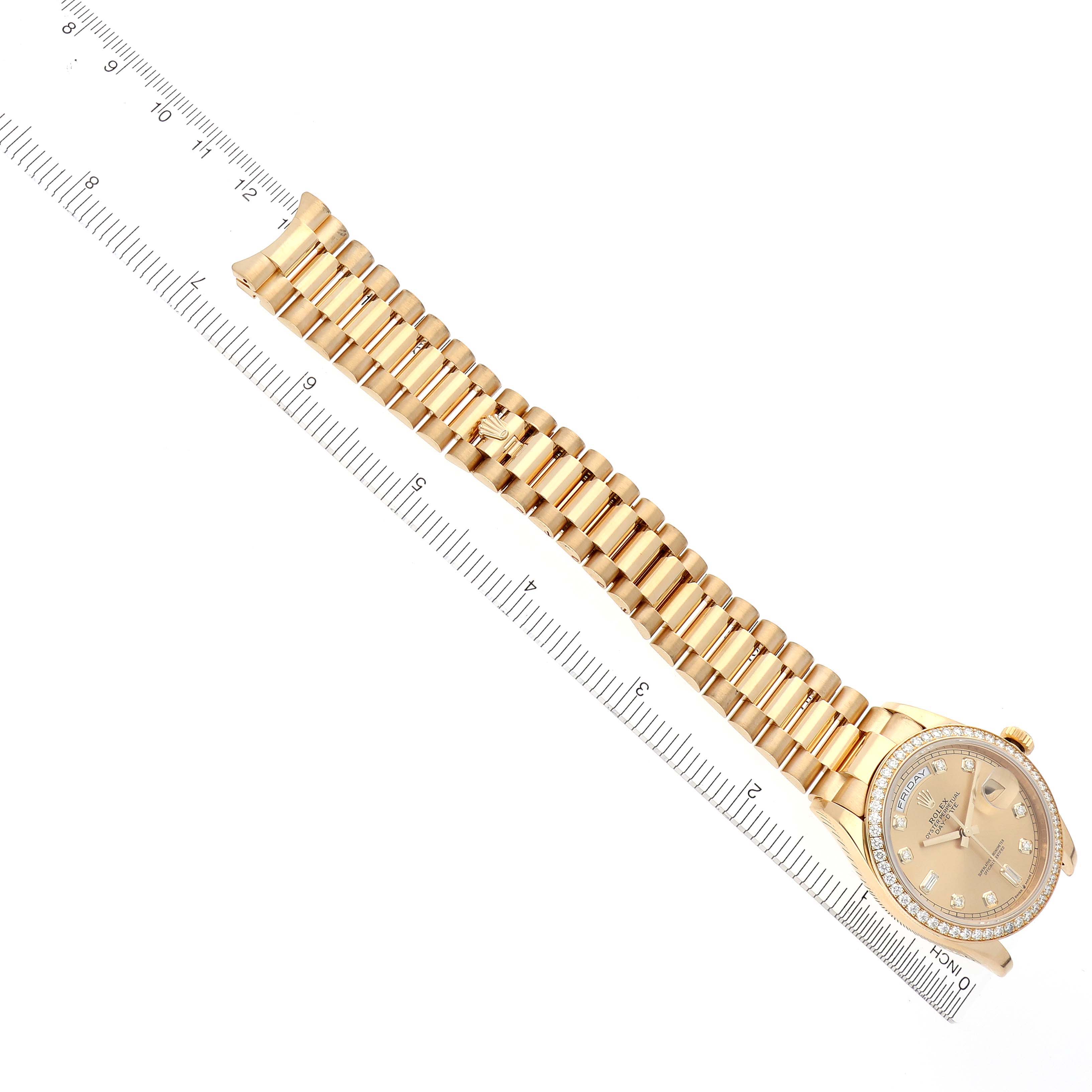 The image shows a top view of a Rolex President 128348 Men's Yellow Gold Champagne Dial 128348 Men's Yellow Gold Champagne Dial watch with a gold band, showcasing the watch face and bracelet beside a ruler.
