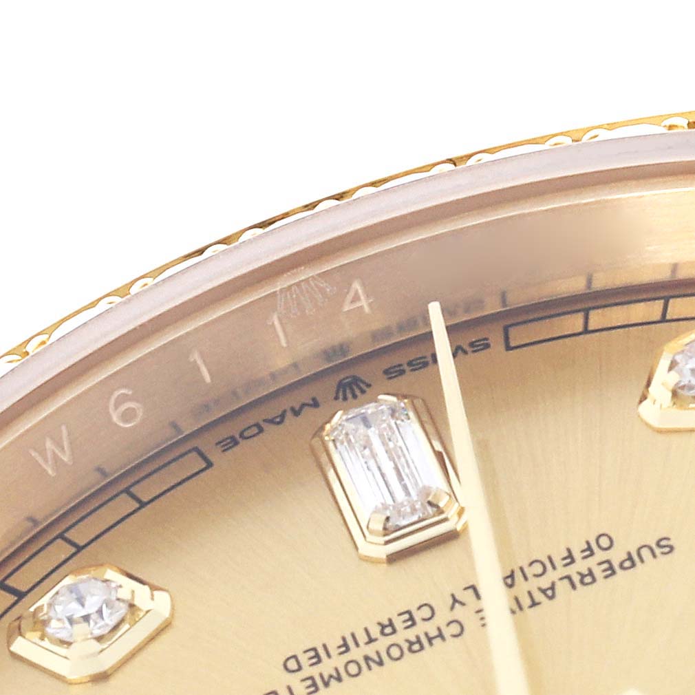 The image shows a close-up of the bezel and dial of a Rolex President 128348 Men's Yellow Gold Champagne Dial 128348 Men's Yellow Gold Champagne Dial watch, highlighting the markers and part of the text.