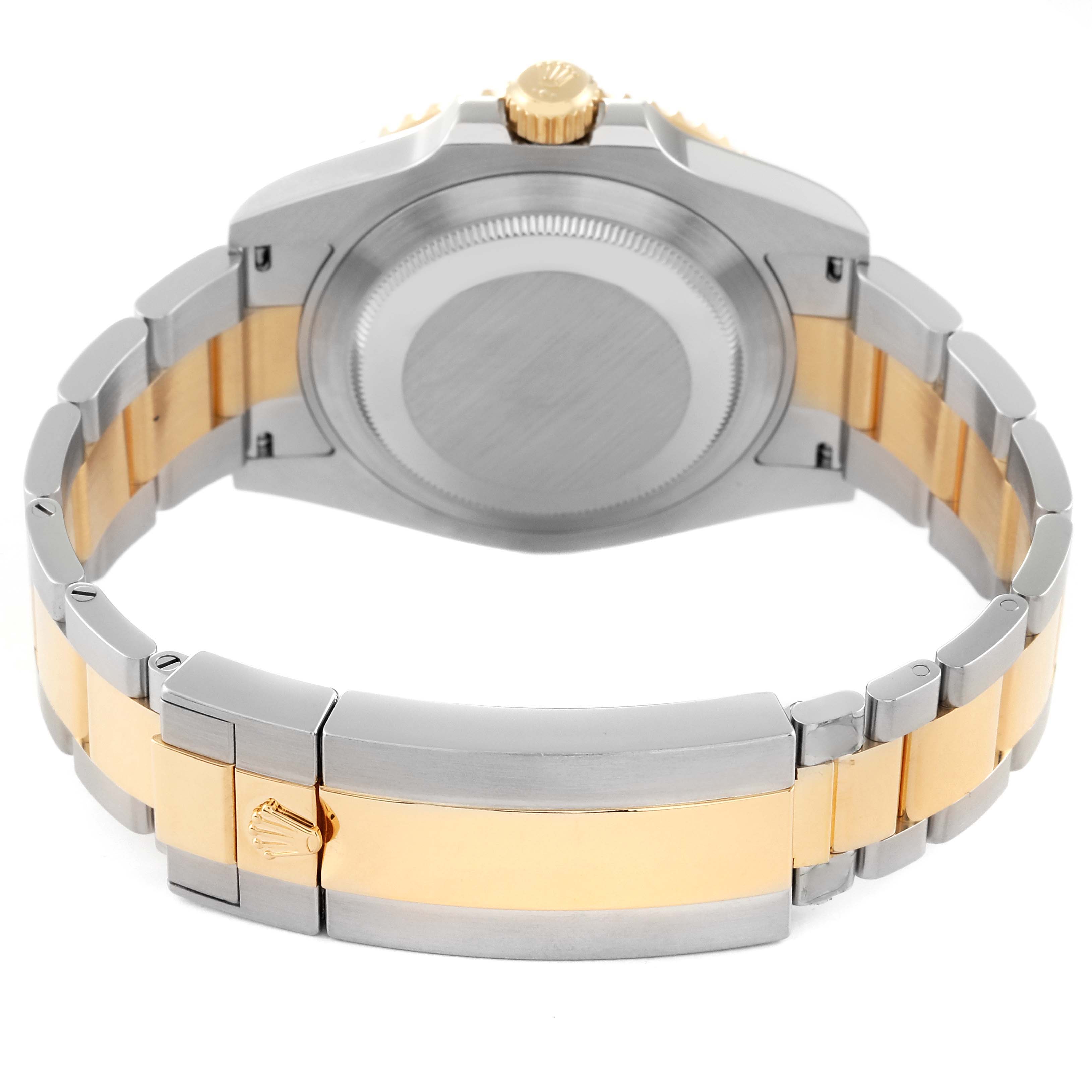 The image shows the back case and bracelet clasp of a Rolex Submariner 126613 Men's Steel and Gold (two tone) Black Dial 126613 Men's Steel and Gold (two tone) Black Dial watch, emphasizing its two-tone design.