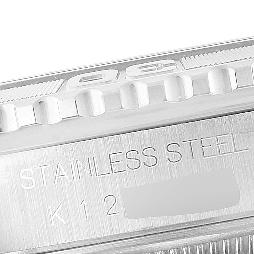 The image shows a close-up of the bezel and case side of a stainless steel Rolex Turn-o-Graph 16264 Men's Stainless Steel Black Dial 16264 Men's Stainless Steel Black Dial watch, including engravings.