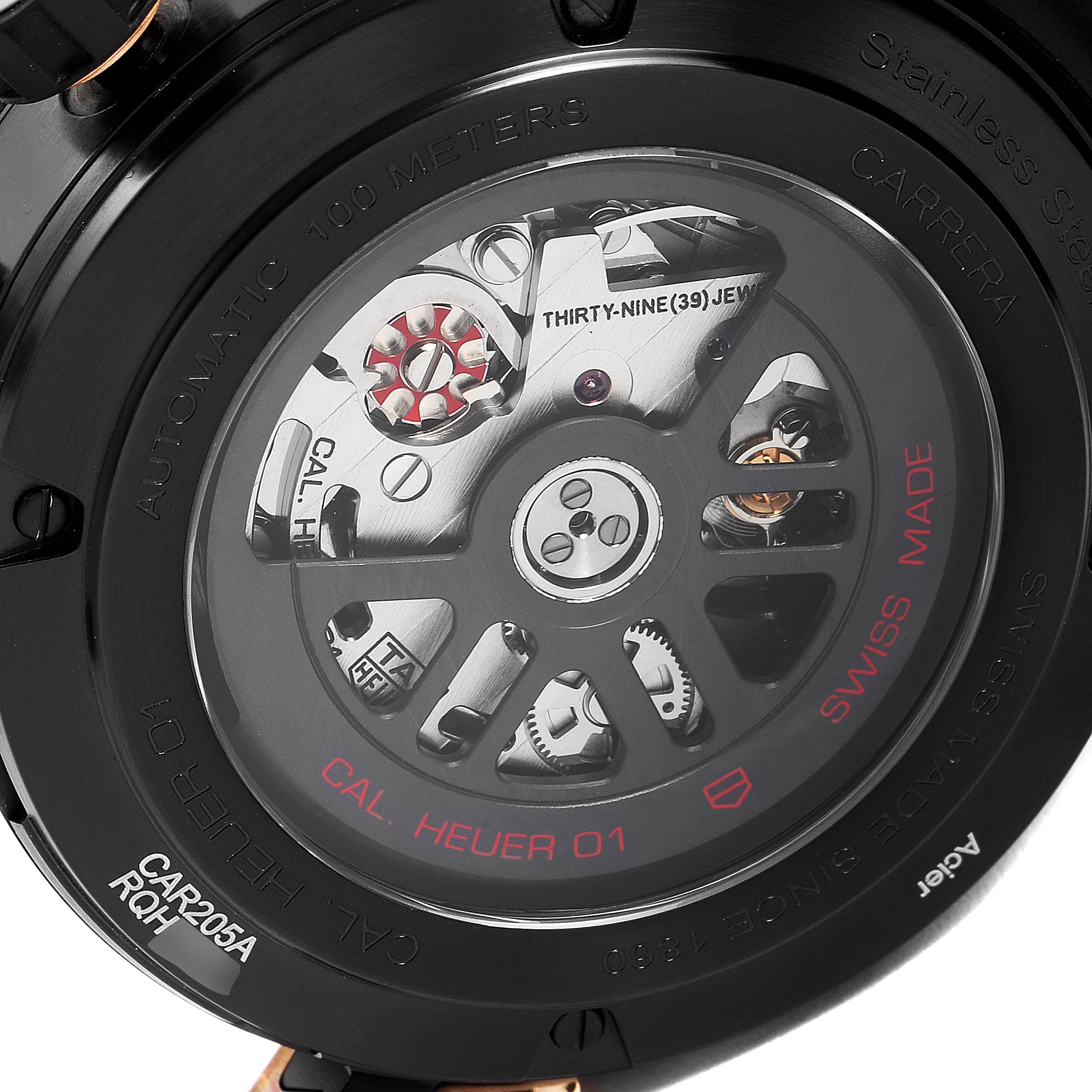 The image shows the back casing and internal movement of a Tag Heuer Carrera CAR205A.FT6087 Men's Titanium Black Dial CAR205A.FT6087 Men's Titanium Black Dial watch, focusing on the mechanical components.