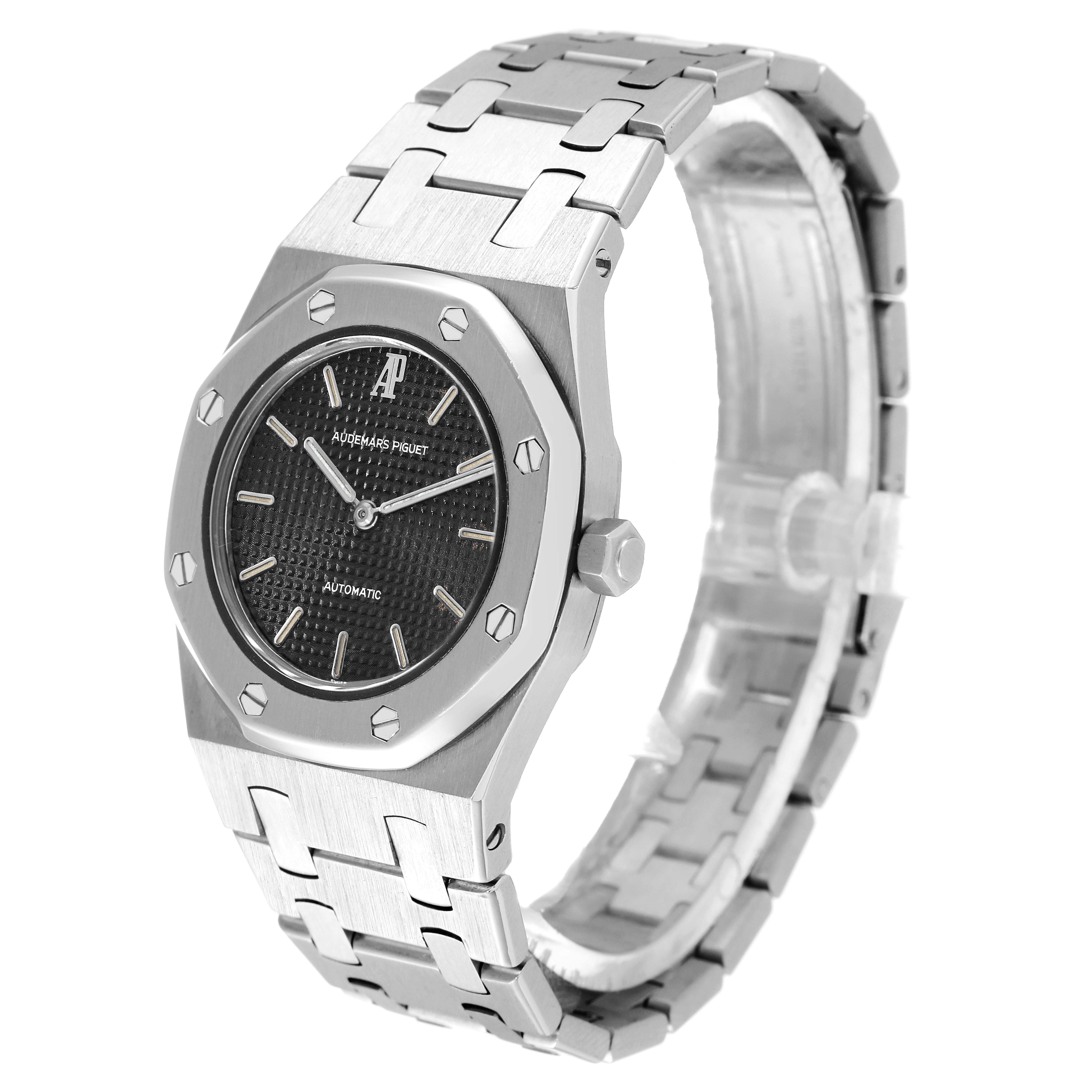 This image shows a Royal Oak model by Audemars Piguet from a three-quarter angle, highlighting the face, bezel, and bracelet.