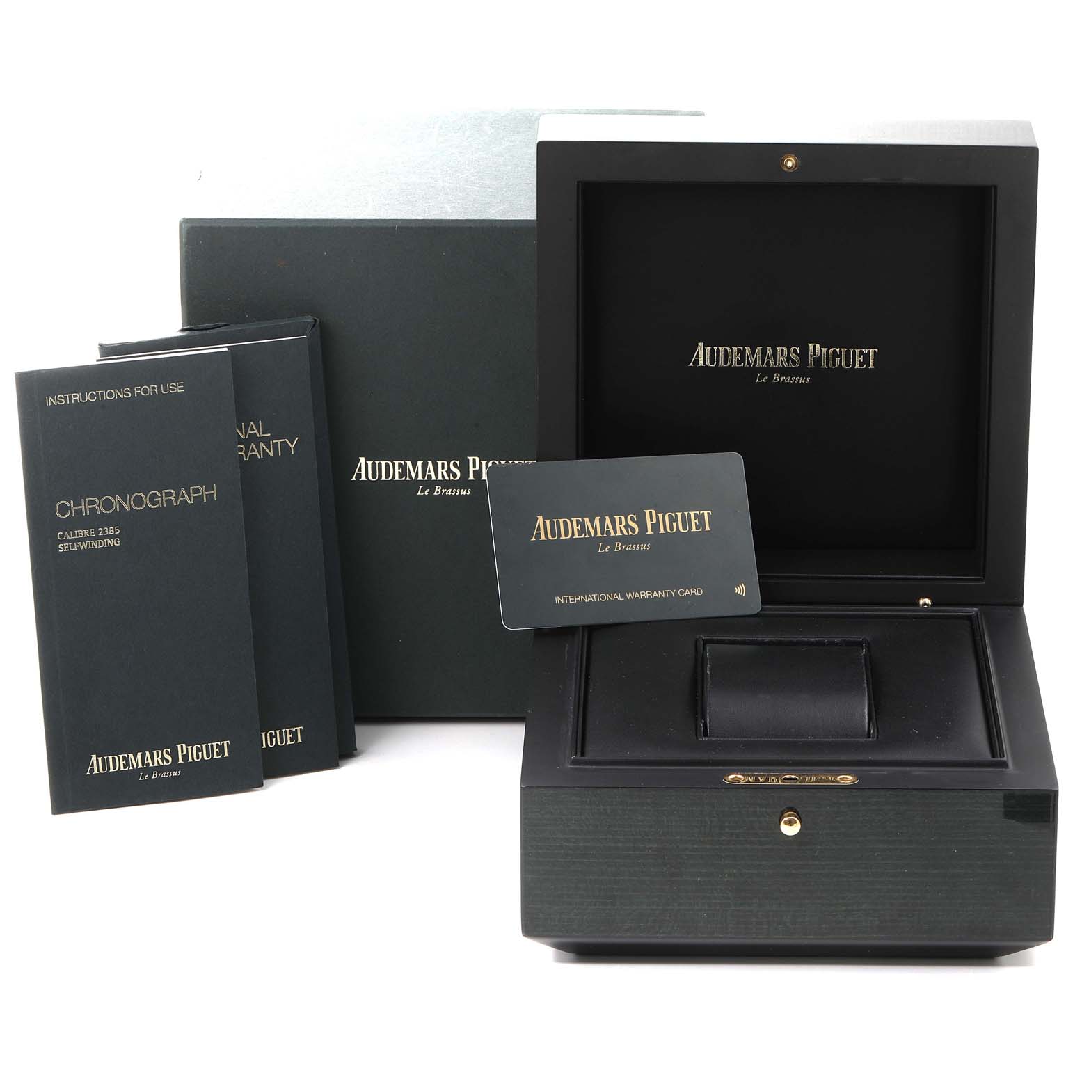 The image shows the packaging, instruction manuals, and warranty card for an Audemars Piguet Royal Oak 15400ST.OO.1220ST.03 Men's Stainless Steel Blue Dial 15400ST.OO.1220ST.03 Men's Stainless Steel Blue Dial watch.