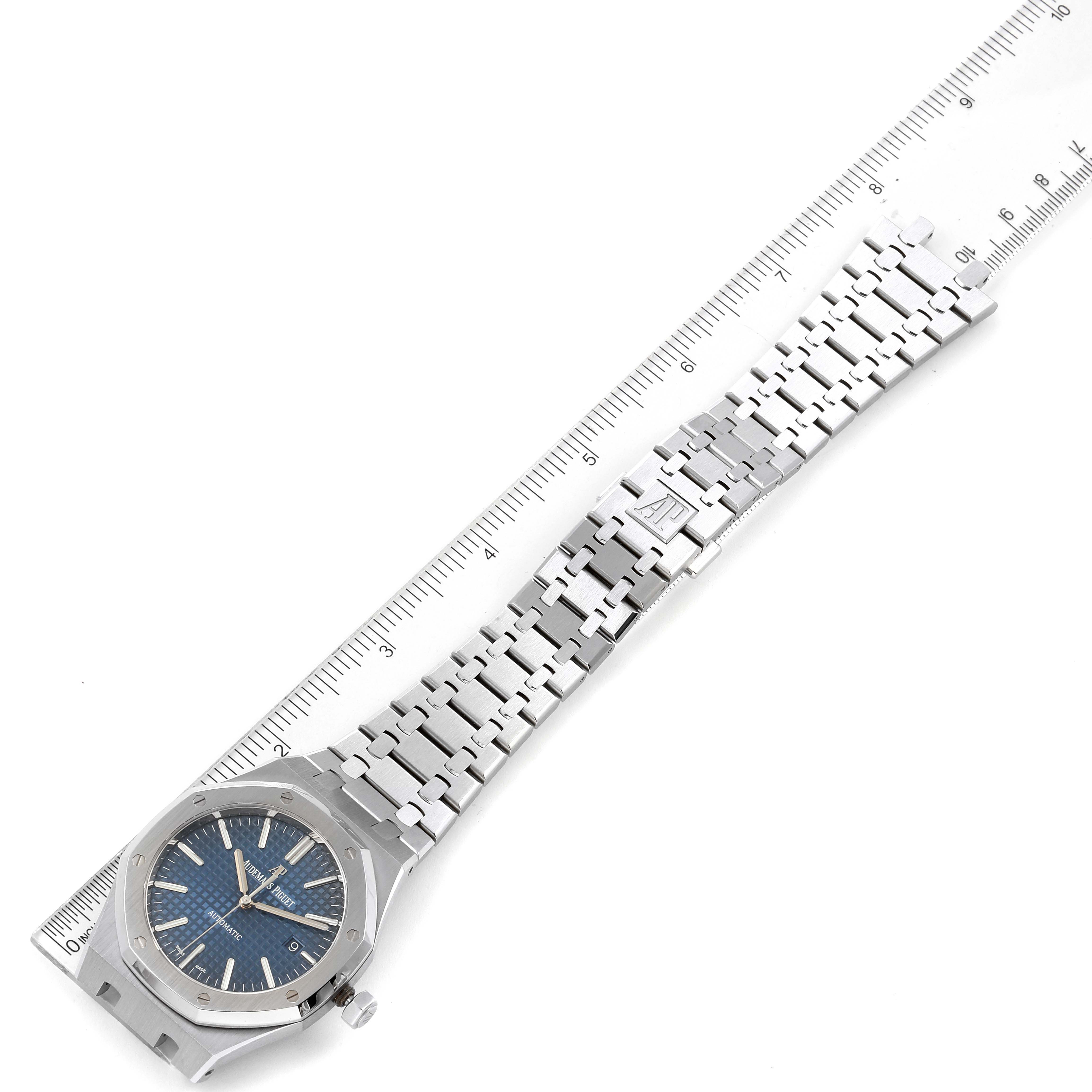 The image shows the Audemars Piguet Royal Oak 15400ST.OO.1220ST.03 Men's Stainless Steel Blue Dial 15400ST.OO.1220ST.03 Men's Stainless Steel Blue Dial watch laid flat and measured against a ruler, displaying its strap and dial.