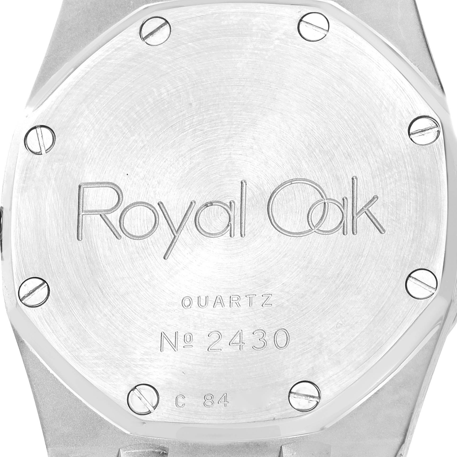 This image shows the case back of a Royal Oak model by Audemars Piguet, highlighting its engraved details and screws.