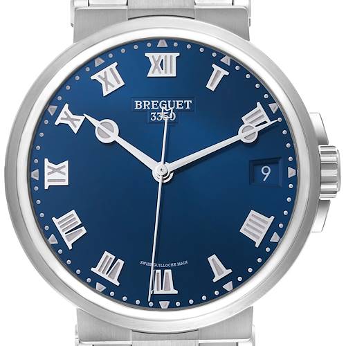 The Breguet Marine watch is shown from a frontal angle, highlighting its blue dial, Roman numerals, and date window.