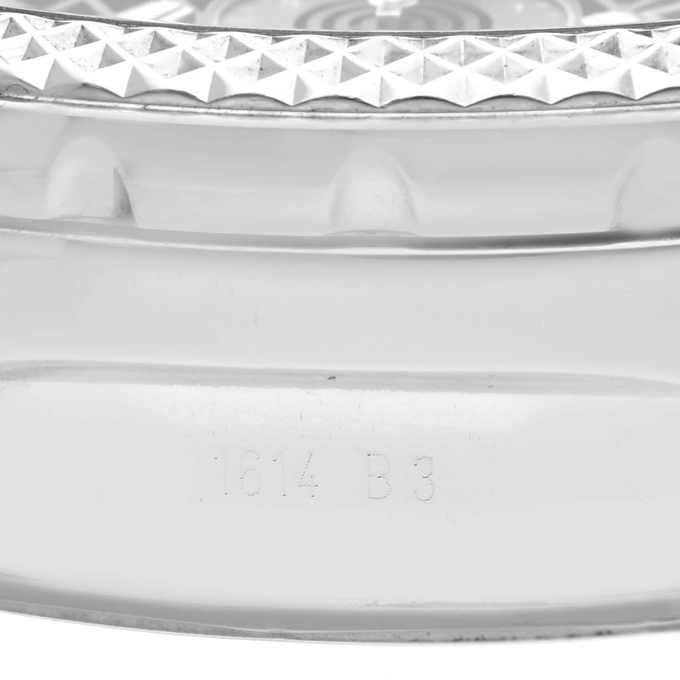 The image shows a close-up view of the side of a Breitling Bentley AB061112.BD80.990A Men's Stainless Steel Black Dial AB061112.BD80.990A Men's Stainless Steel Black Dial watch, highlighting its bezel and engraved model number.