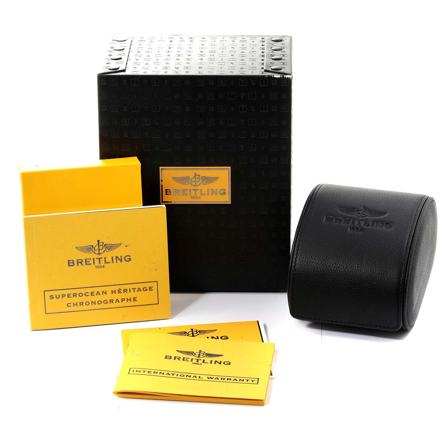 The image shows a Breitling Superocean A13320 Men's Stainless Steel Brown Dial A13320 Men's Stainless Steel Brown Dial watch box, a black leather case, warranty card, and instruction booklets from a front angle.