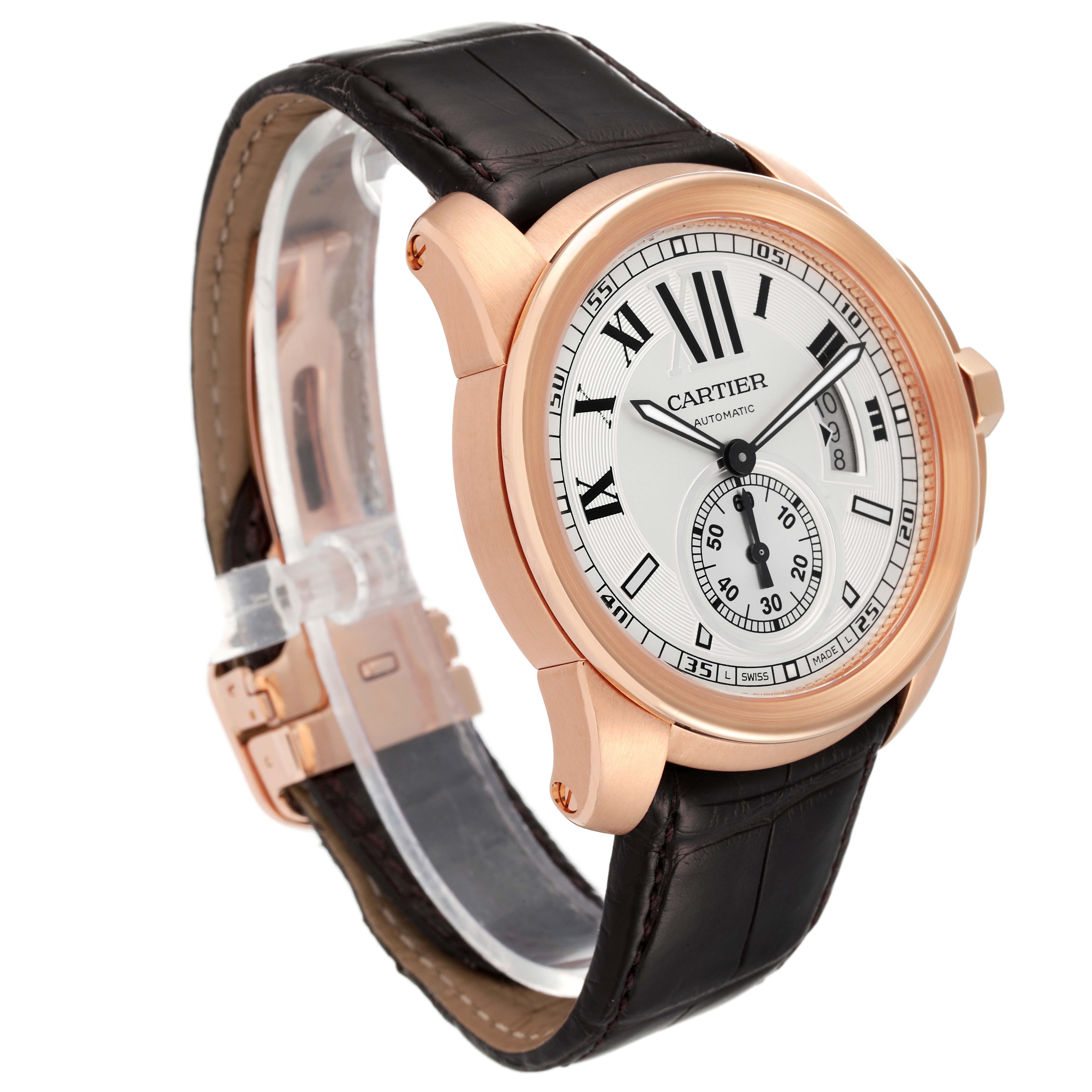 The Calibre de Cartier watch by Cartier is shown at a three-quarter angle, displaying the dial, case, and leather strap.
