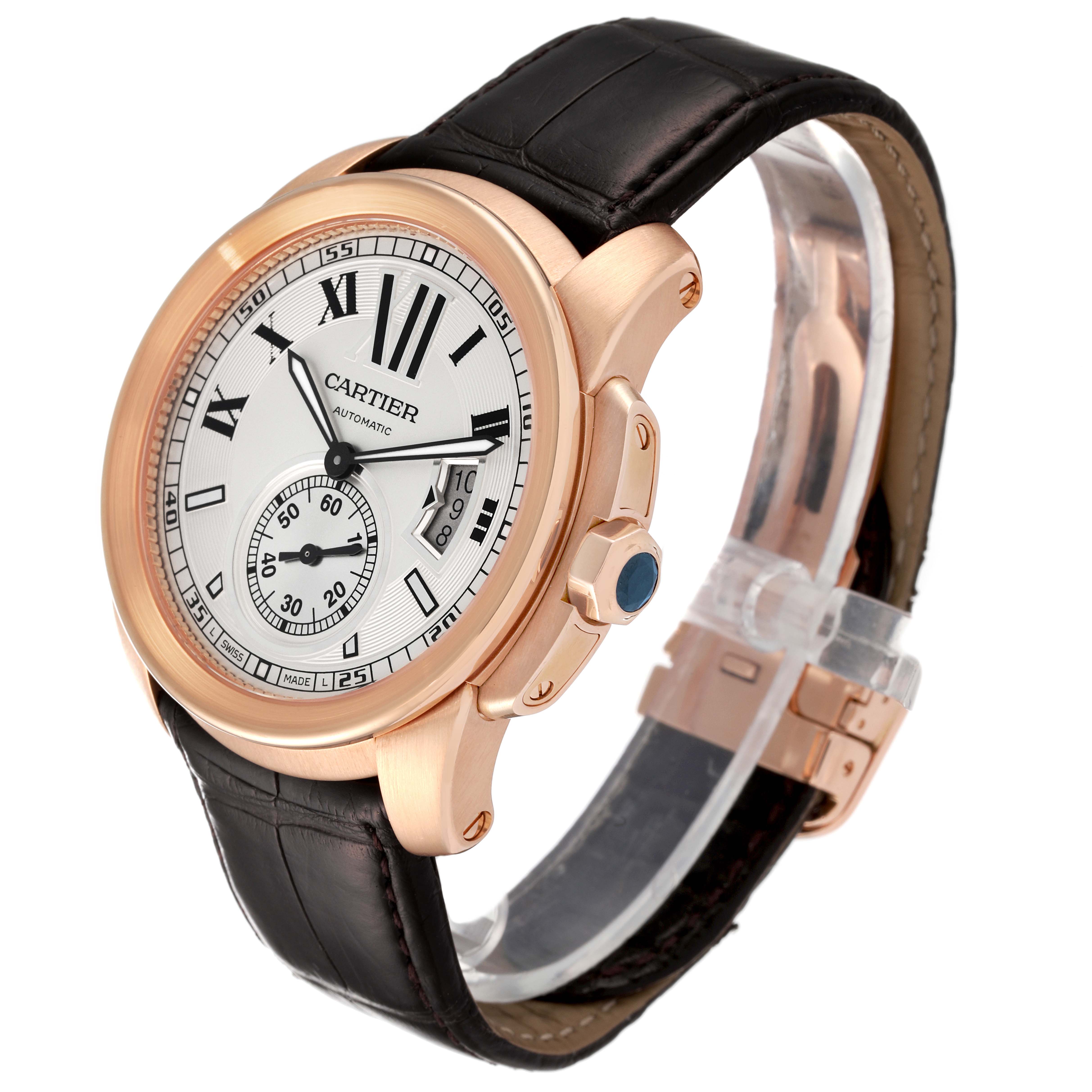 The image shows a side angle of the Calibre de Cartier watch by Cartier, highlighting the dial, case, crown, and strap.