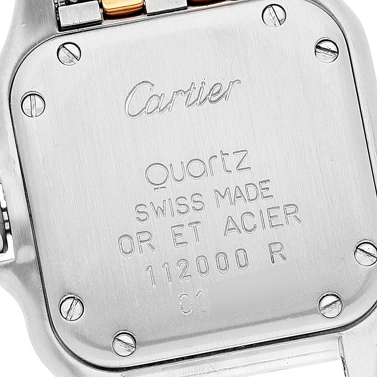 The image shows the back case of a Cartier Panthere W25029B6 Women's Steel and Gold (two tone) Silver Dial W25029B6 Women's Steel and Gold (two tone) Silver Dial watch, highlighting its inscriptions and screws.