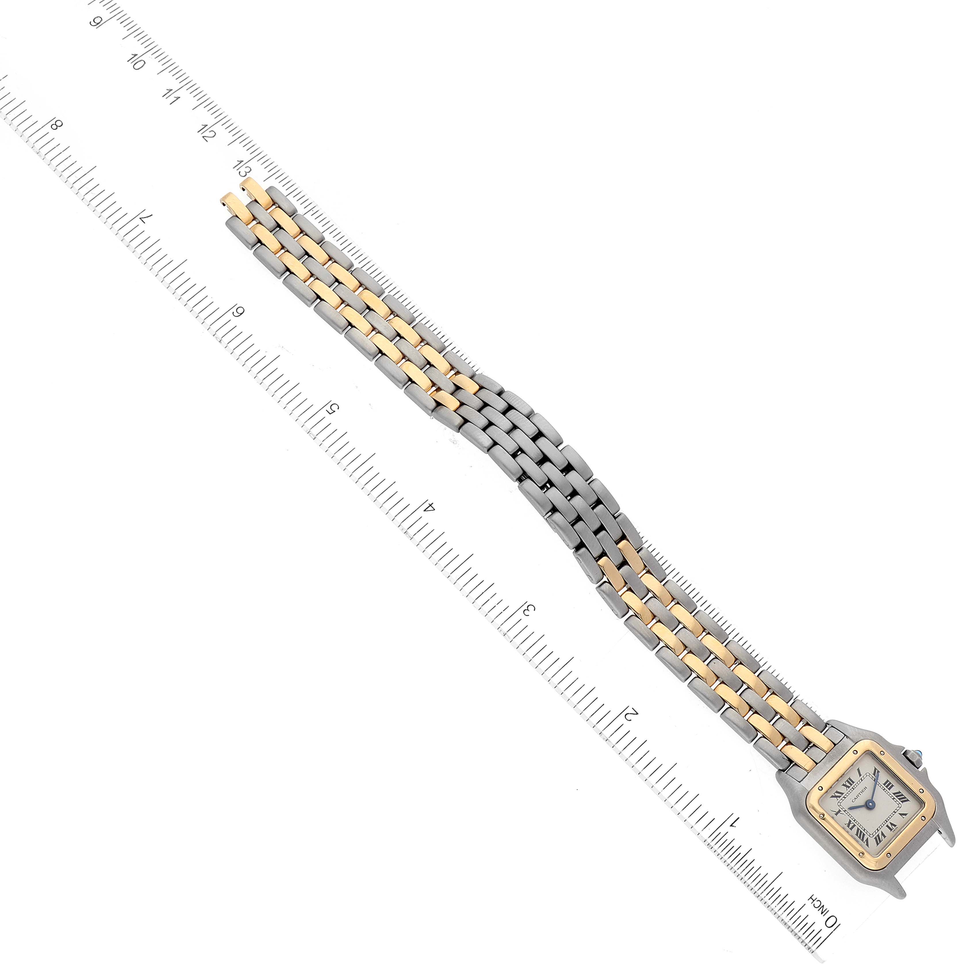 The Panthere model by Cartier is shot from a top-down angle with a focus on its band and face, alongside a ruler for scale.