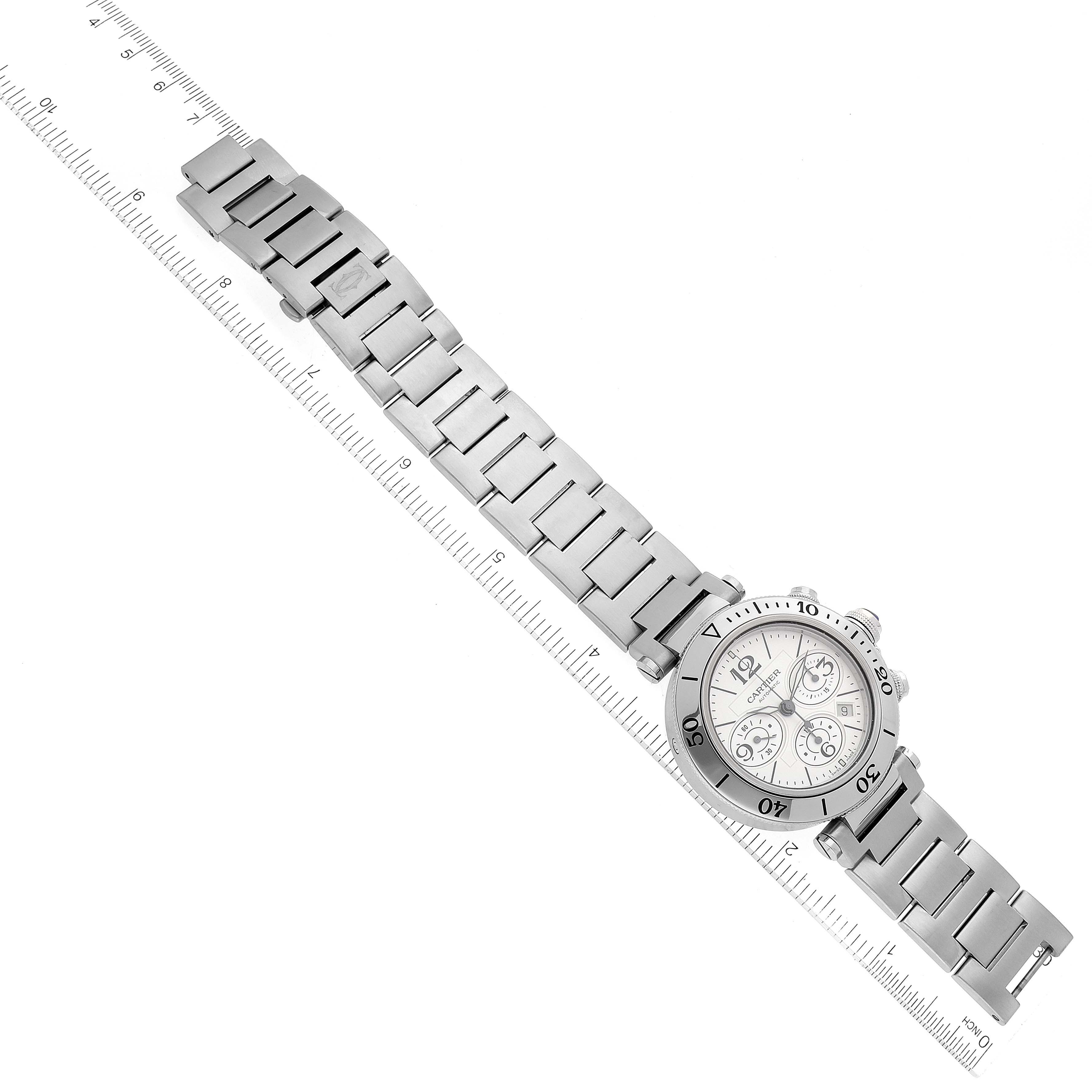 The Cartier Pasha W31089M7 Men
s Stainless Steel Silver Dial watch is shown from a top-down angle, highlighting its full bracelet and round face.