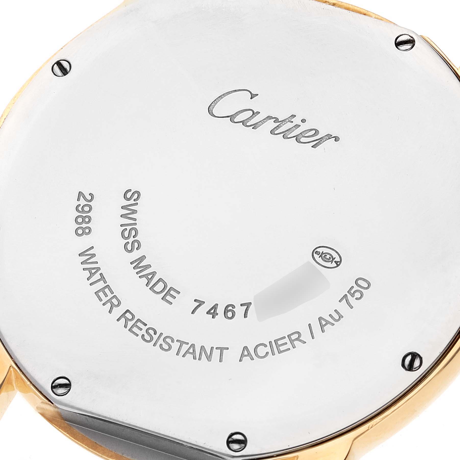 The image shows the back case of a Cartier Ronde W6700455 Men
s Yellow Gold Silver Dial W6700455 Men
s Yellow Gold Silver Dial watch, highlighting its inscriptions and screws.