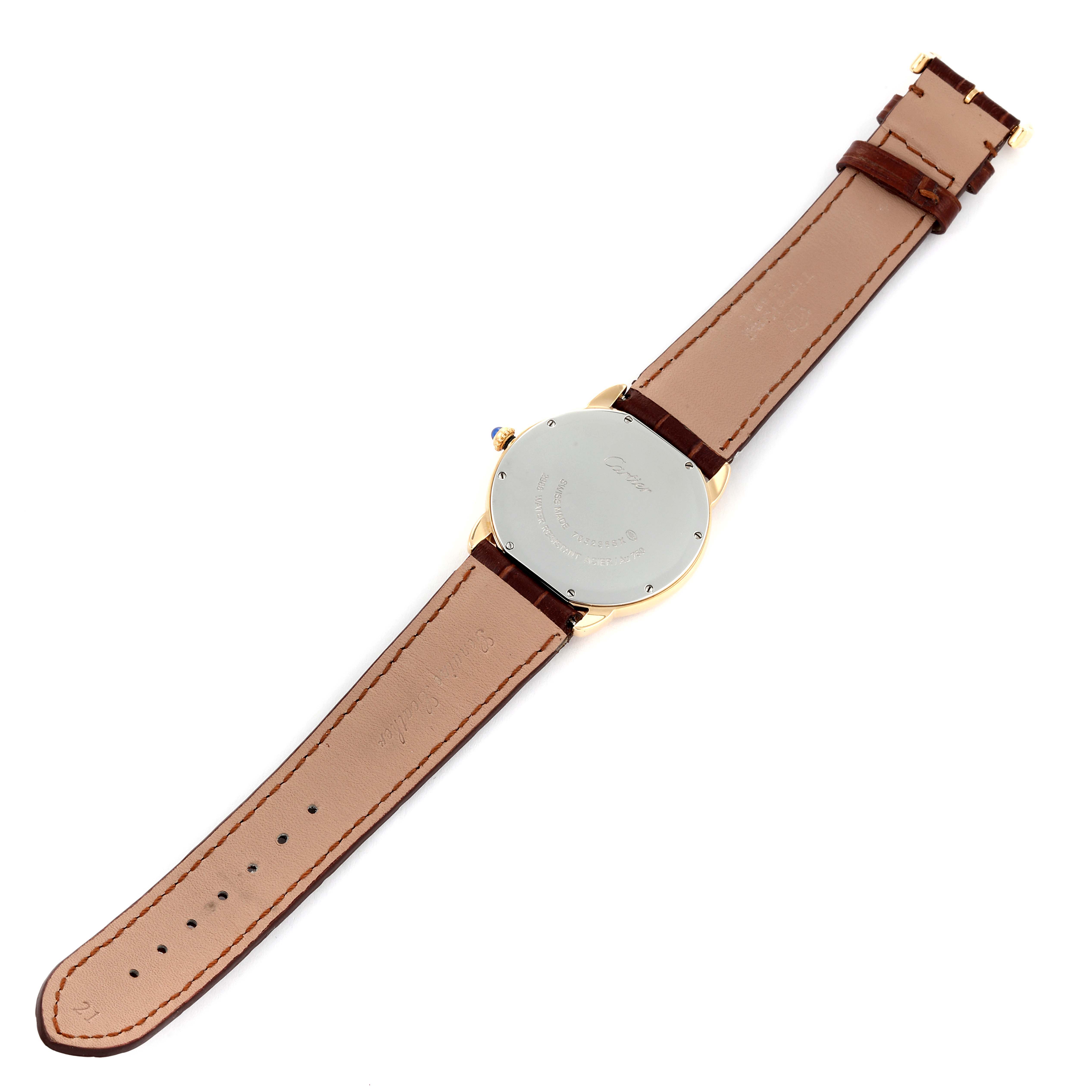 This image shows the back view of the Cartier Ronde W6700455 Men
s Yellow Gold Silver Dial W6700455 Men
s Yellow Gold Silver Dial watch, highlighting its case back and brown leather strap.