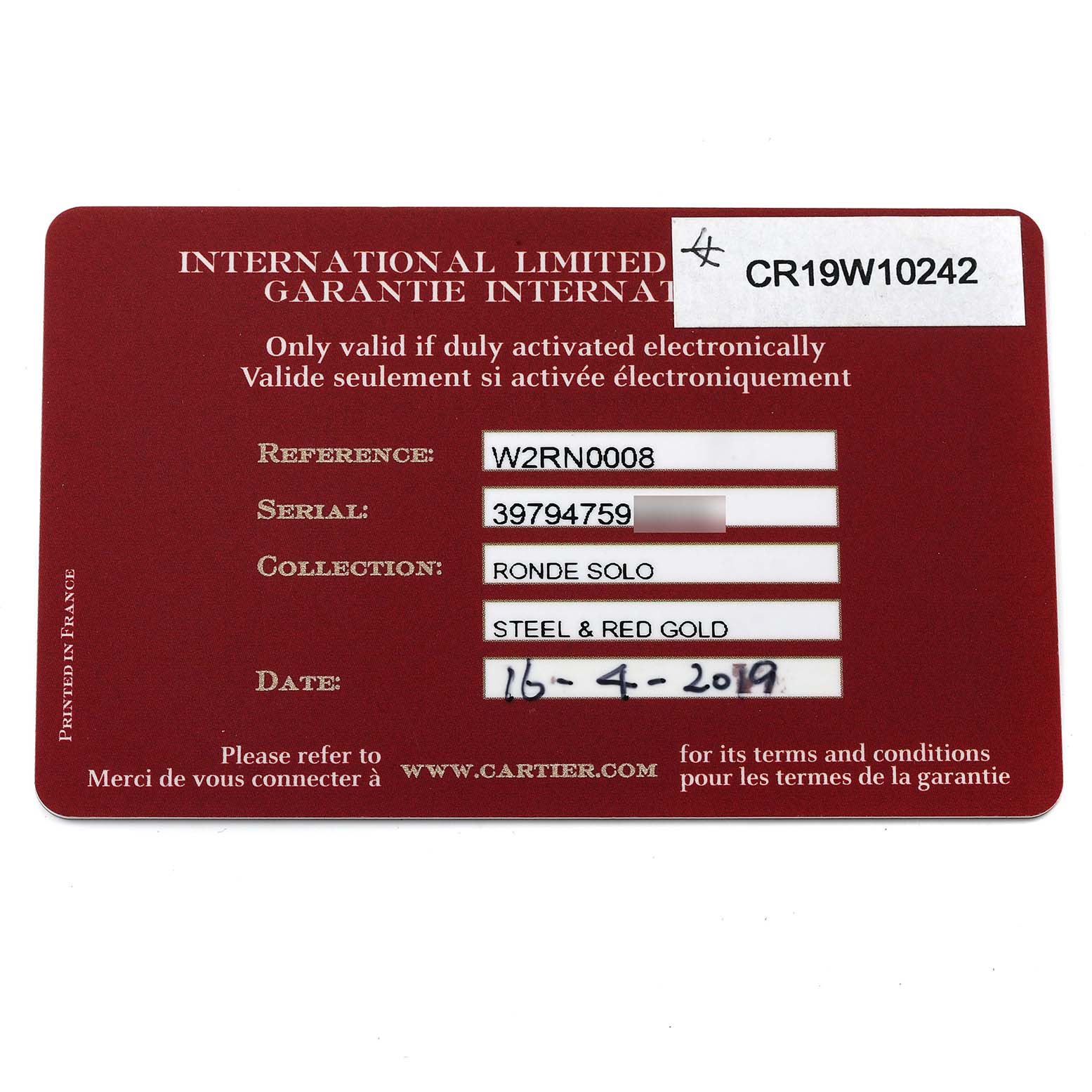 This image shows the International Limited Warranty card for the Cartier Ronde W2RN0008 Men
s Rose Gold Silver Dial W2RN0008 Men
s Rose Gold Silver Dial Solo model, viewed from a top-down angle.
