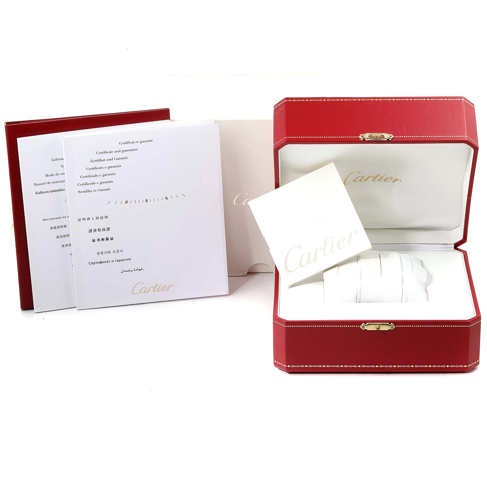 The image shows the packaging, warranty cards, and instruction manuals for a Cartier Santos WSSA0006 Men's Stainless Steel Black Dial WSSA0006 Men's Stainless Steel Black Dial watch.