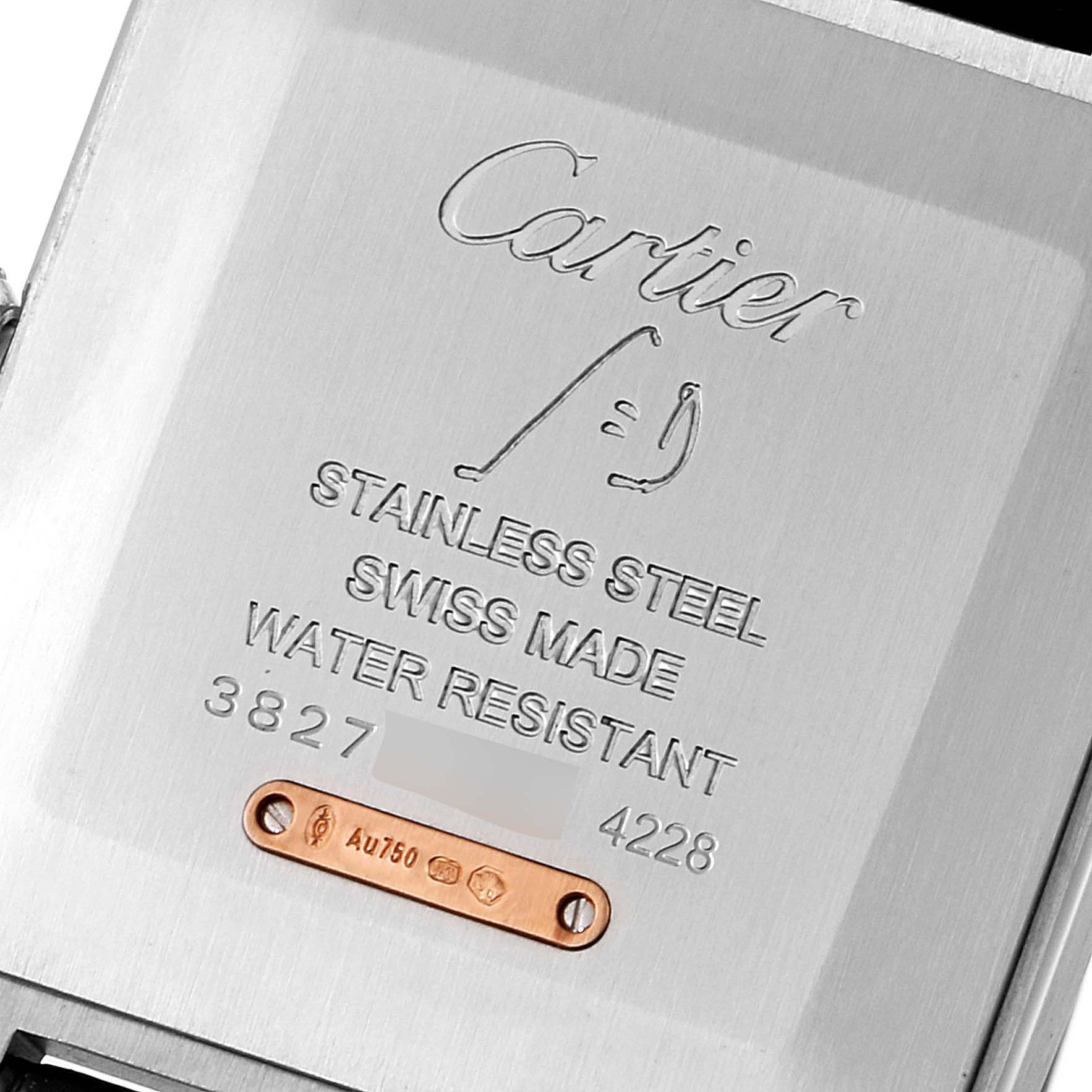 The image shows the case back of a Cartier Santos Dumont W2SA0011 Men's Steel and Gold (two tone) Silver Dial W2SA0011 Men's Steel and Gold (two tone) Silver Dial watch, highlighting its engravings and material details.