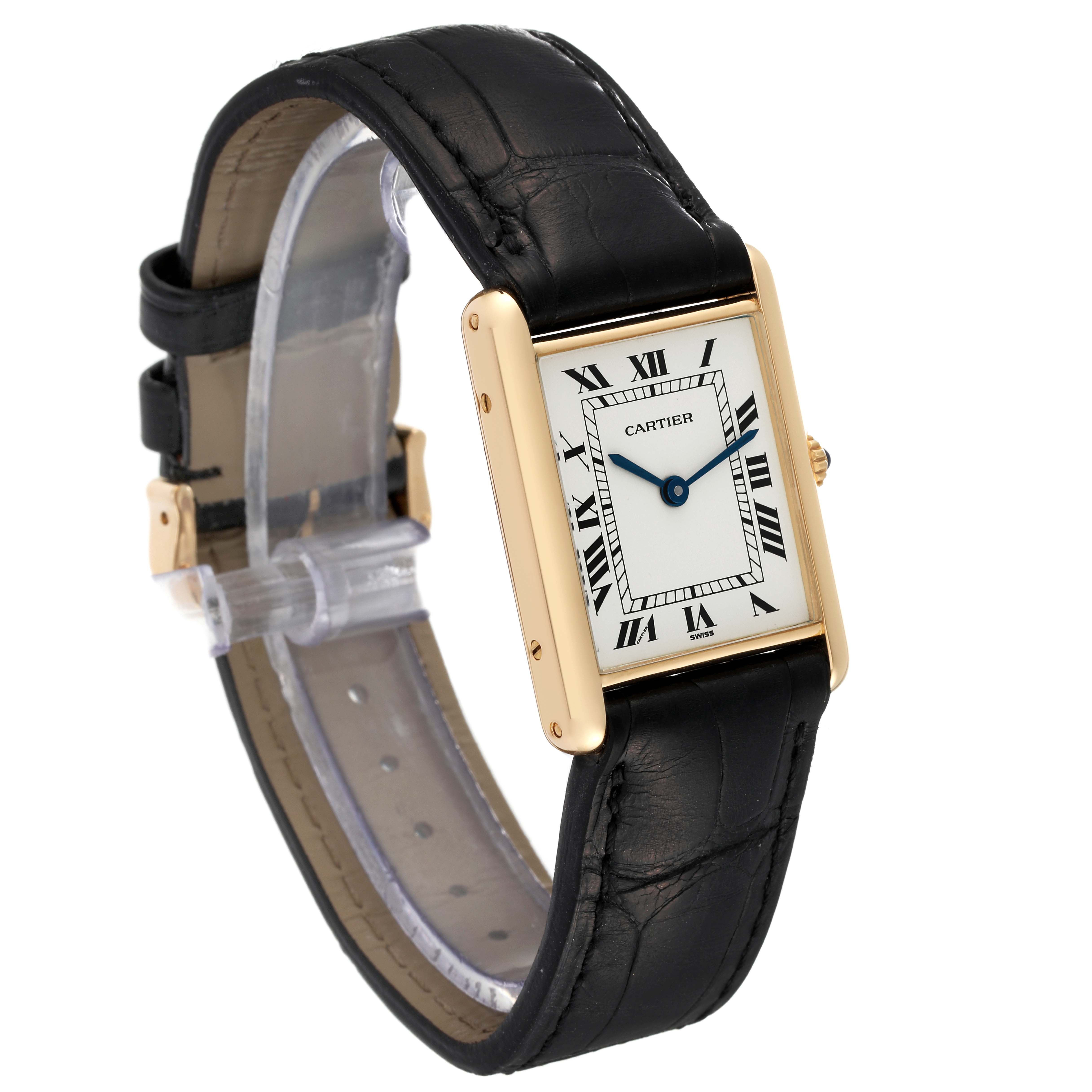 The image shows a Cartier Tank Classic Women's Yellow Gold White Dial Women's Yellow Gold White Dial watch, highlighting its rectangular face, black leather strap, and gold-tone casing at a slight angle.