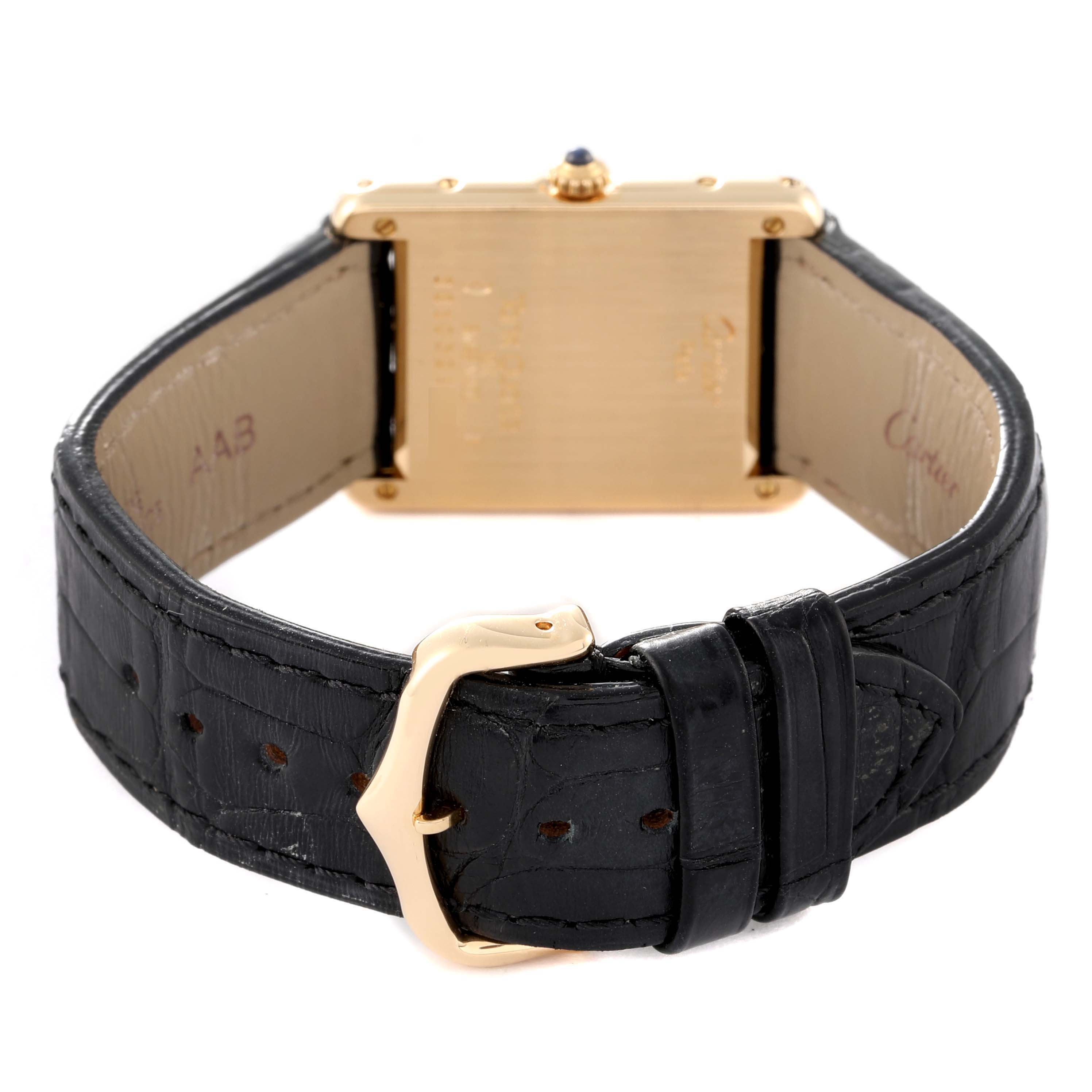 The image shows the back of the Tank Classic model by Cartier, focusing on the clasp and leather strap with the case back visible.