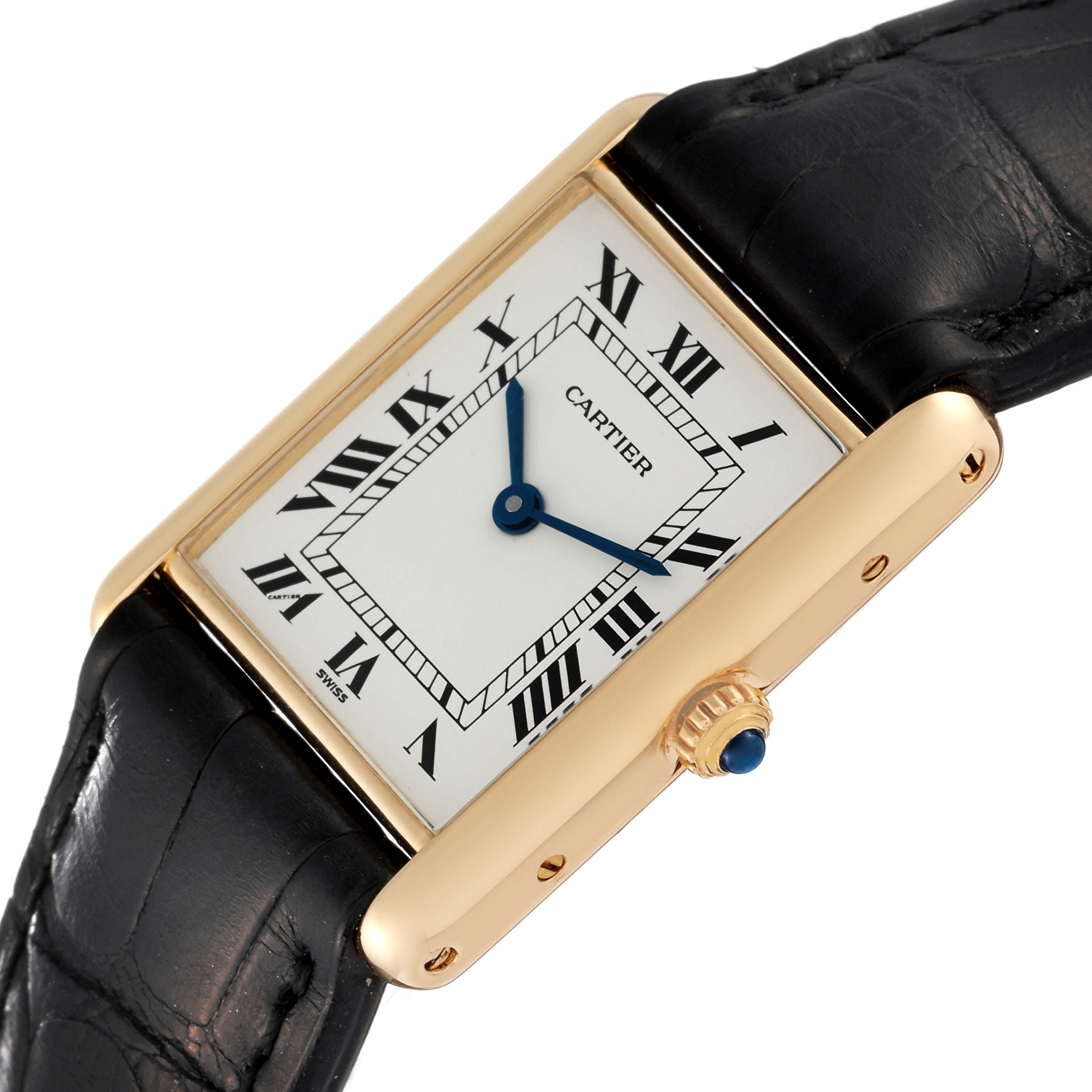 The image shows a close-up of the Cartier Tank Classic Women's Yellow Gold White Dial Women's Yellow Gold White Dial watch, highlighting its dial, Roman numerals, and leather strap.