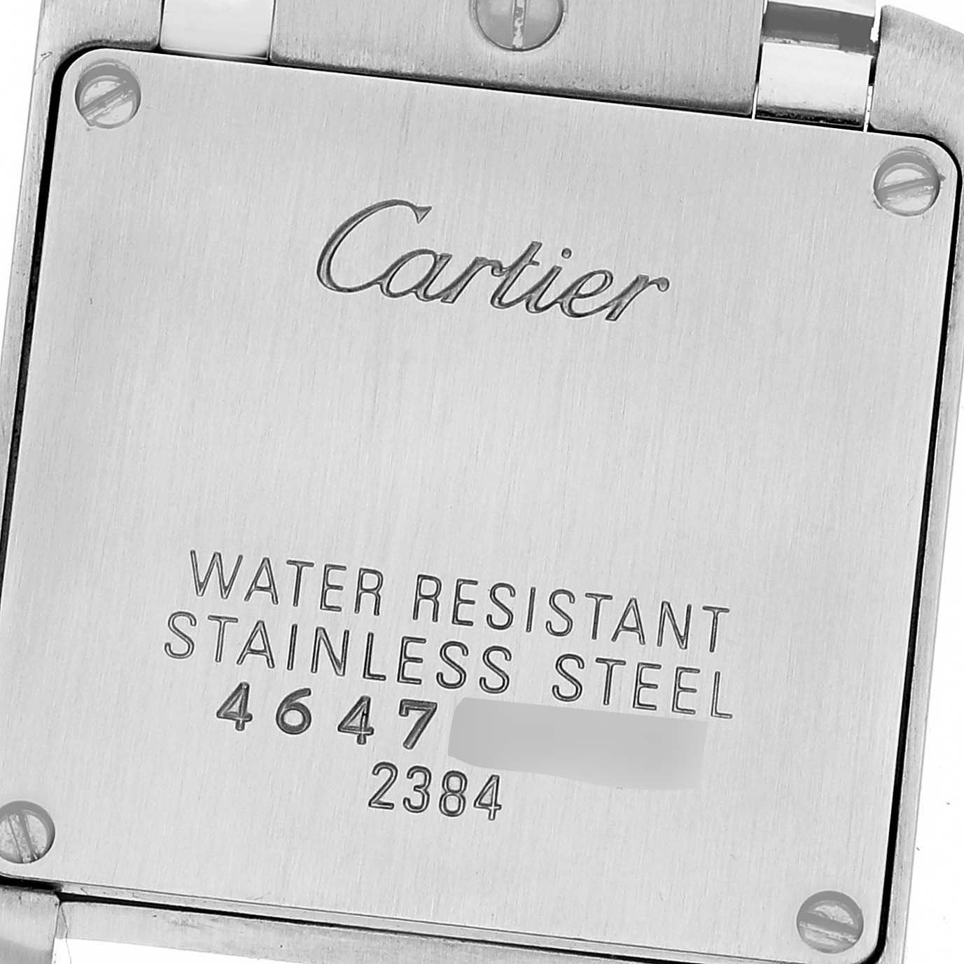 This image shows the back case of a Tank Francaise watch by Cartier, displaying the screws and engraved details.