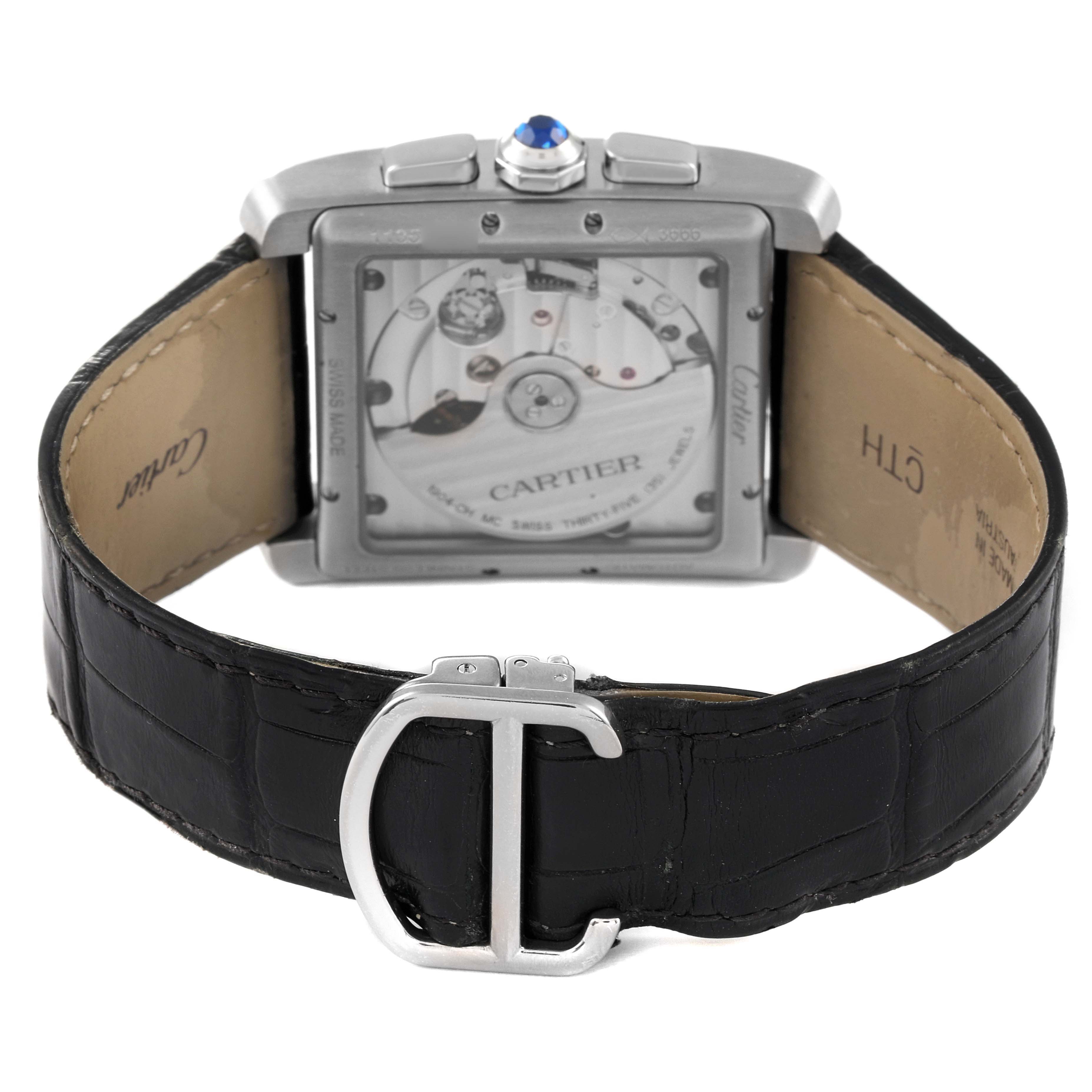 This image shows the back of the Cartier Tank MC W5330008 Men's Stainless Steel Grey Dial W5330008 Men's Stainless Steel Grey Dial watch, highlighting the movement and the leather strap with a "C"-shaped buckle.