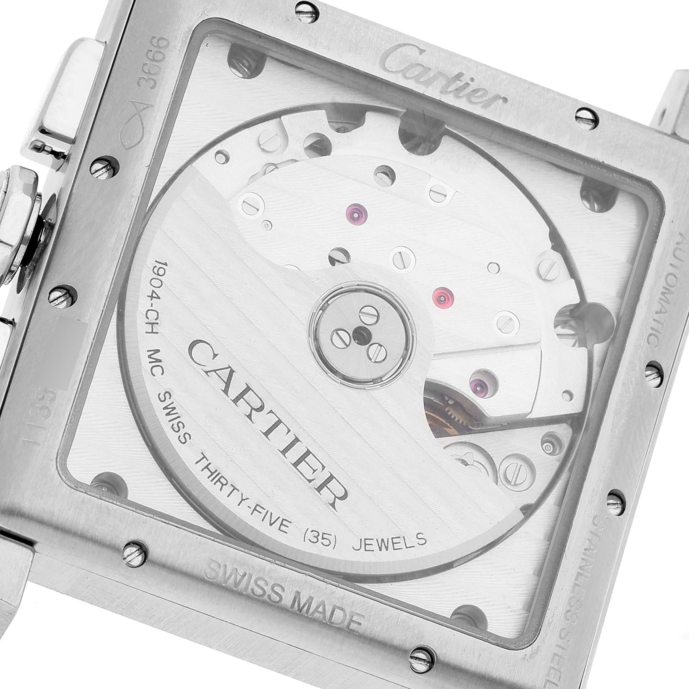 The image shows the back view of a Cartier Tank MC W5330008 Men's Stainless Steel Grey Dial W5330008 Men's Stainless Steel Grey Dial watch, displaying its internal mechanism and engravings.