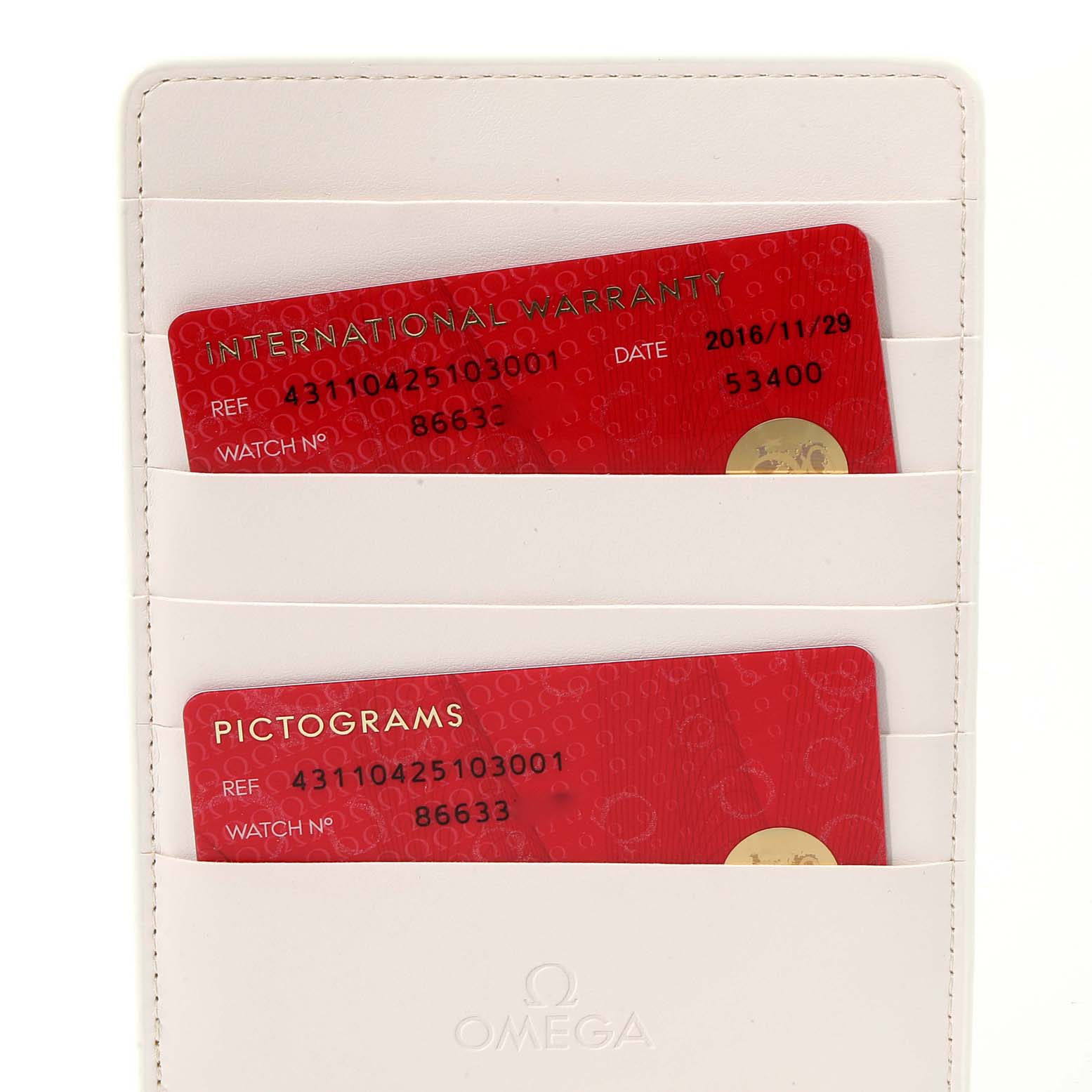 This image shows the warranty and pictogram cards for the Omega De Ville 431.10.42.51.03.001 Men's Stainless Steel Blue Dial 431.10.42.51.03.001 Men's Stainless Steel Blue Dial watch in a white cardholder.