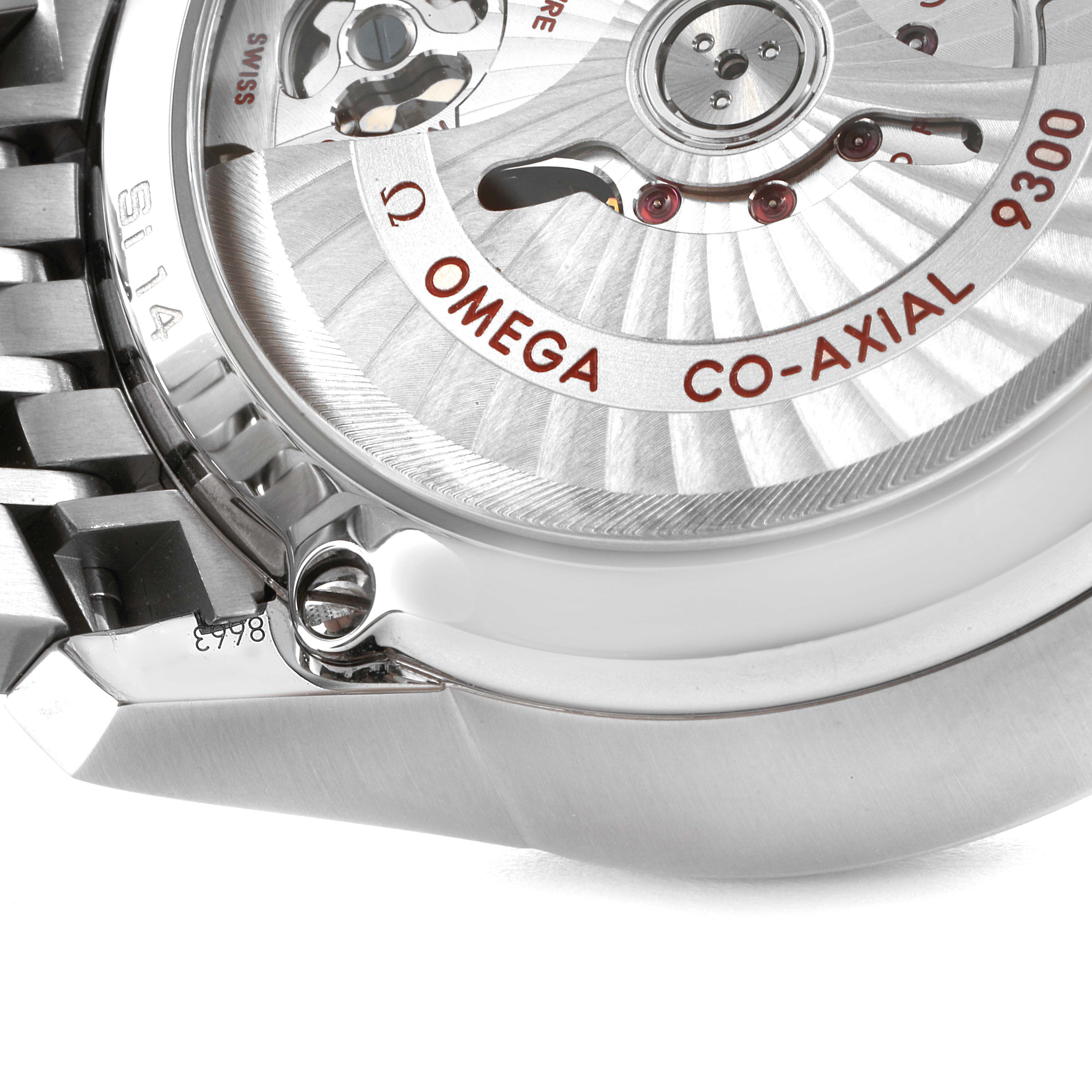 The image shows the back view of an Omega De Ville 431.10.42.51.01.001 Men's Stainless Steel Black Dial 431.10.42.51.01.001 Men's Stainless Steel Black Dial watch, highlighting the co-axial movement and part of the stainless steel bracelet.