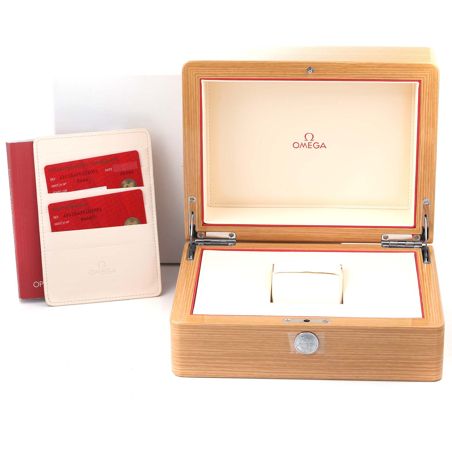 The image shows an open Omega De Ville 431.10.42.51.02.001 Men's Stainless Steel Silver Dial 431.10.42.51.02.001 Men's Stainless Steel Silver Dial watch box with its interior and a watch booklet with cards beside it.