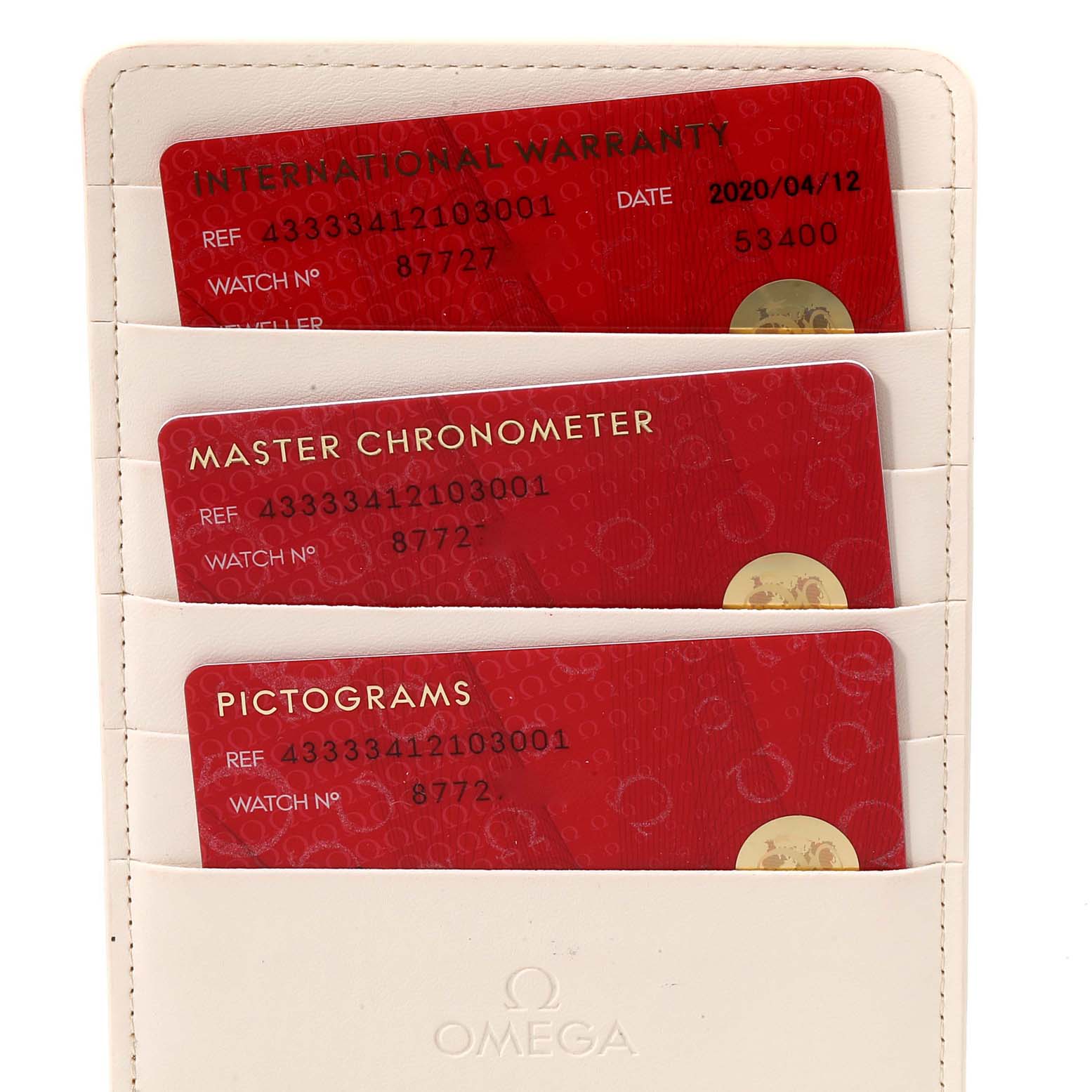 This image shows the warranty and certification cards for the Omega De Ville 433.33.41.21.03.001 Men's Stainless Steel Blue Dial 433.33.41.21.03.001 Men's Stainless Steel Blue Dial watch.