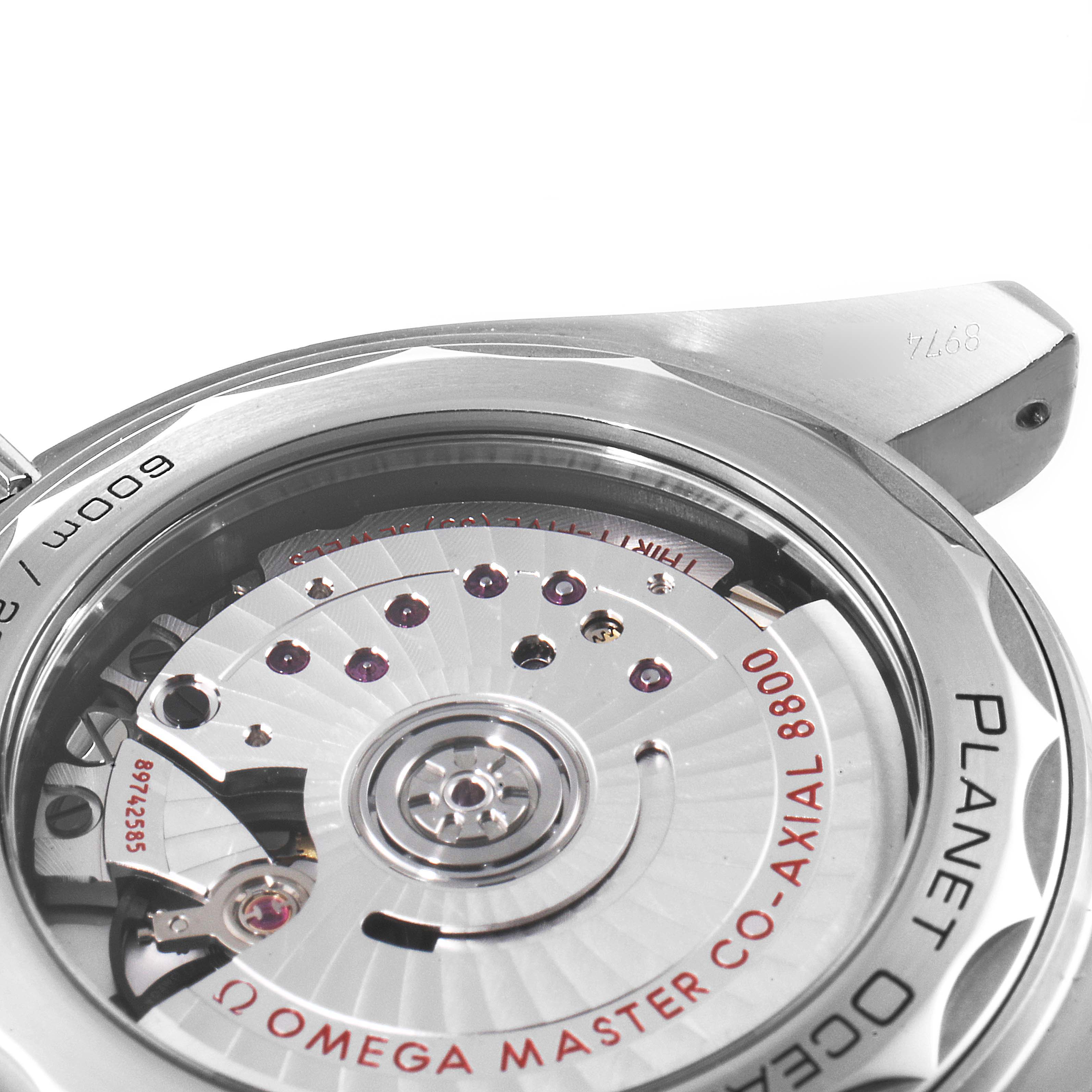 This image shows a close-up view of the movement and case back of the Omega Planet Ocean 215.30.40.20.01.001 Men's Stainless Steel Black Dial 215.30.40.20.01.001 Men's Stainless Steel Black Dial watch.