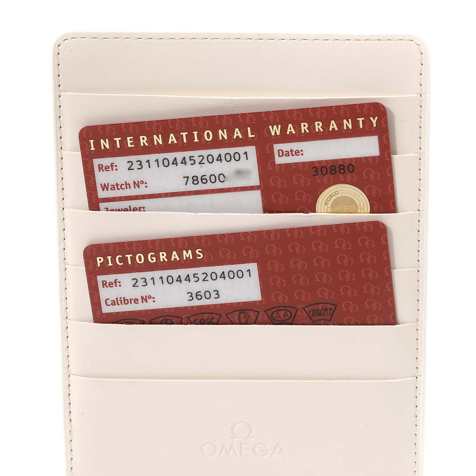 This image shows the warranty and pictogram cards for the Omega Aqua Terra 231.10.44.52.04.001 Men
s Stainless Steel White Dial 231.10.44.52.04.001 Men
s Stainless Steel White Dial model, placed in a cardholder.