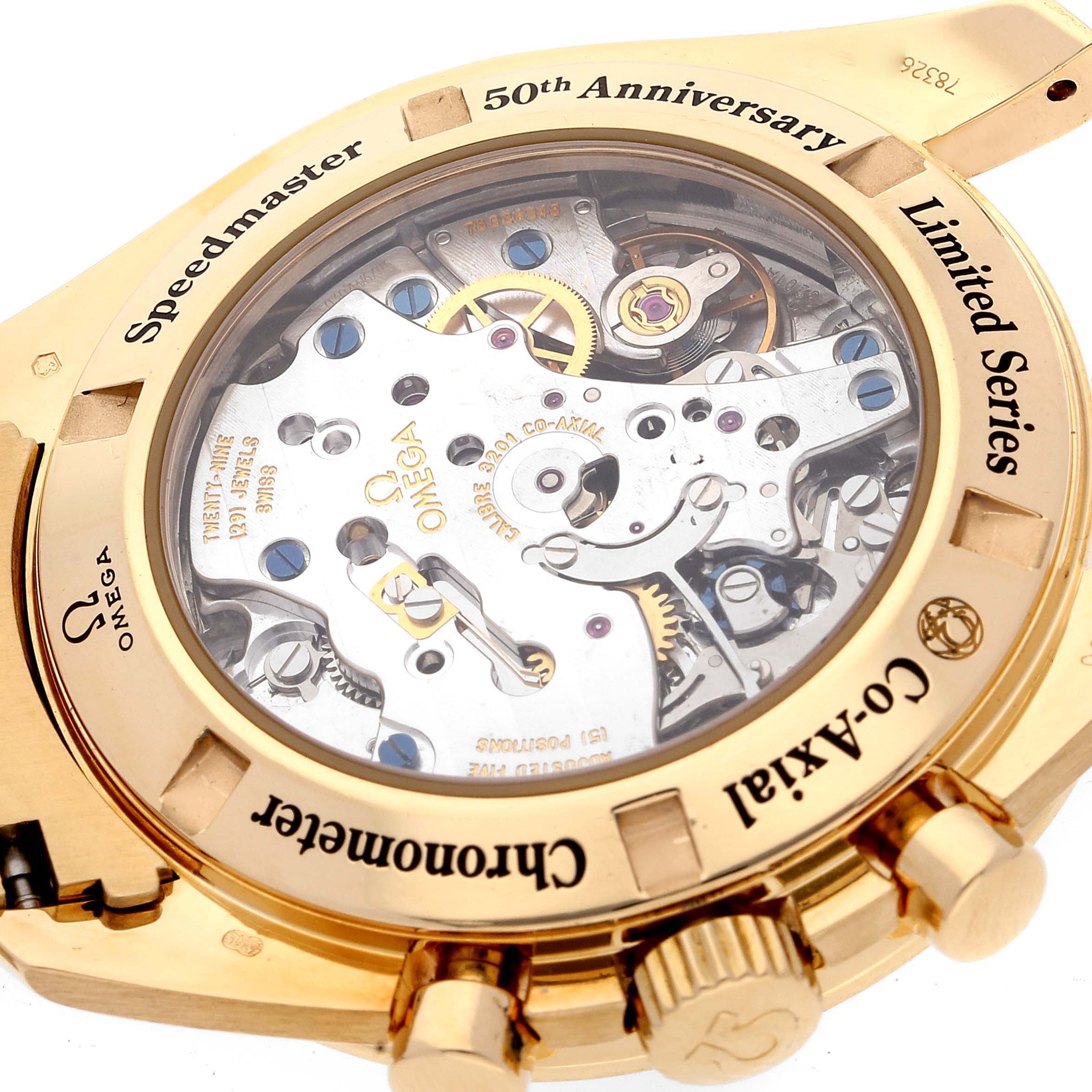 This image shows the back view of an Omega Speedmaster 311.63.42.50.01.002 Men's Yellow Gold Black Dial 311.63.42.50.01.002 Men's Yellow Gold Black Dial 50th Anniversary Limited Series watch, highlighting the movement and inscriptions.