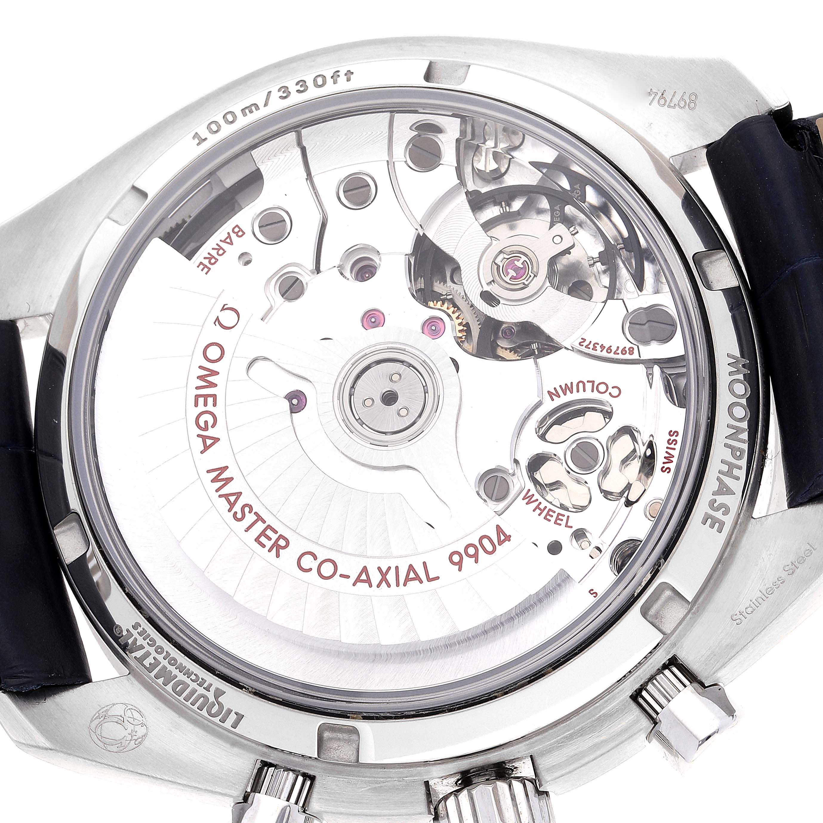 The image shows the back view of an Omega Speedmaster 304.33.44.52.03.001 Men's Stainless Steel Blue Dial 304.33.44.52.03.001 Men's Stainless Steel Blue Dial, displaying its internal mechanism and case details.