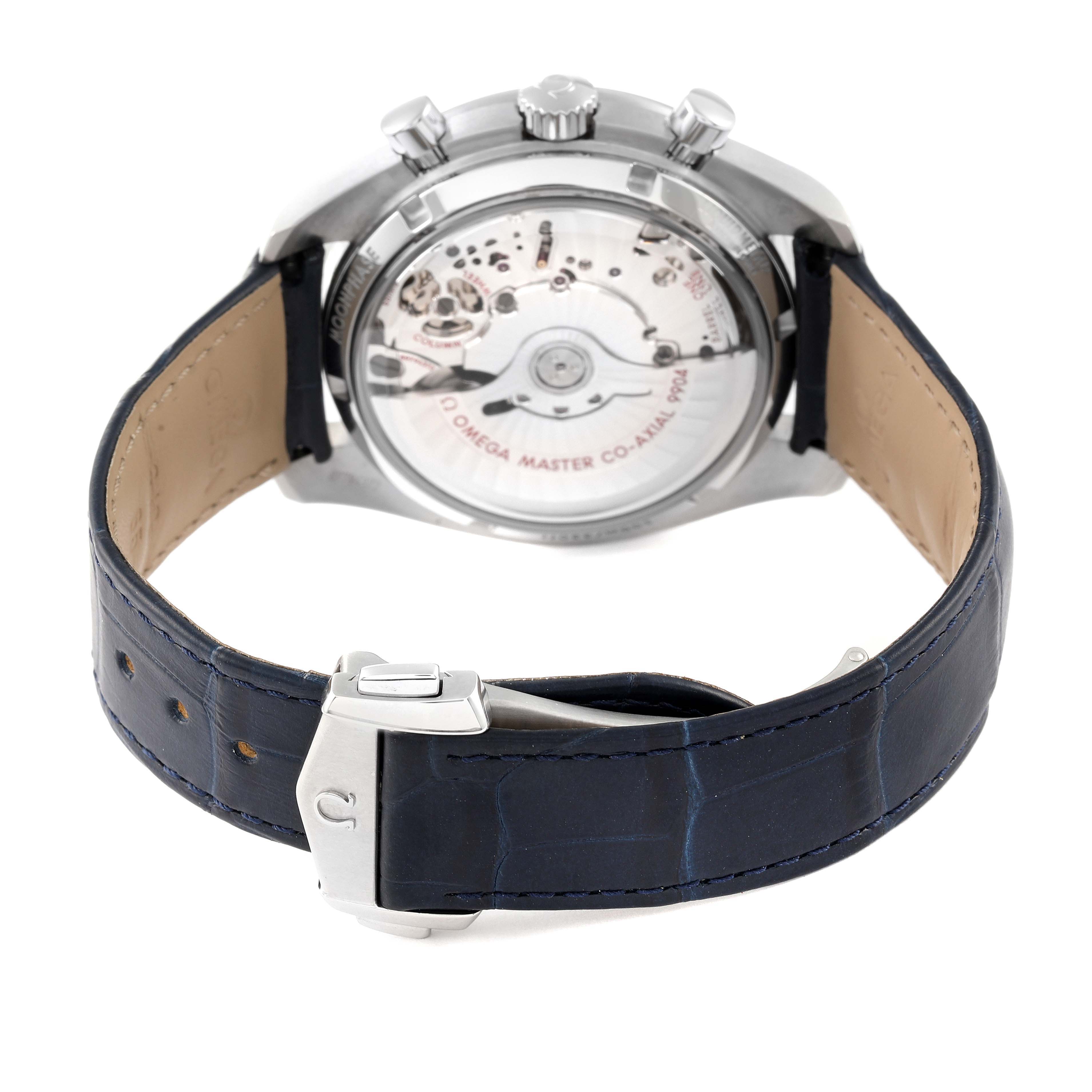 The image shows the back of an Omega Speedmaster 304.33.44.52.03.001 Men's Stainless Steel Blue Dial 304.33.44.52.03.001 Men's Stainless Steel Blue Dial watch with the movement and part of the blue leather strap visible.